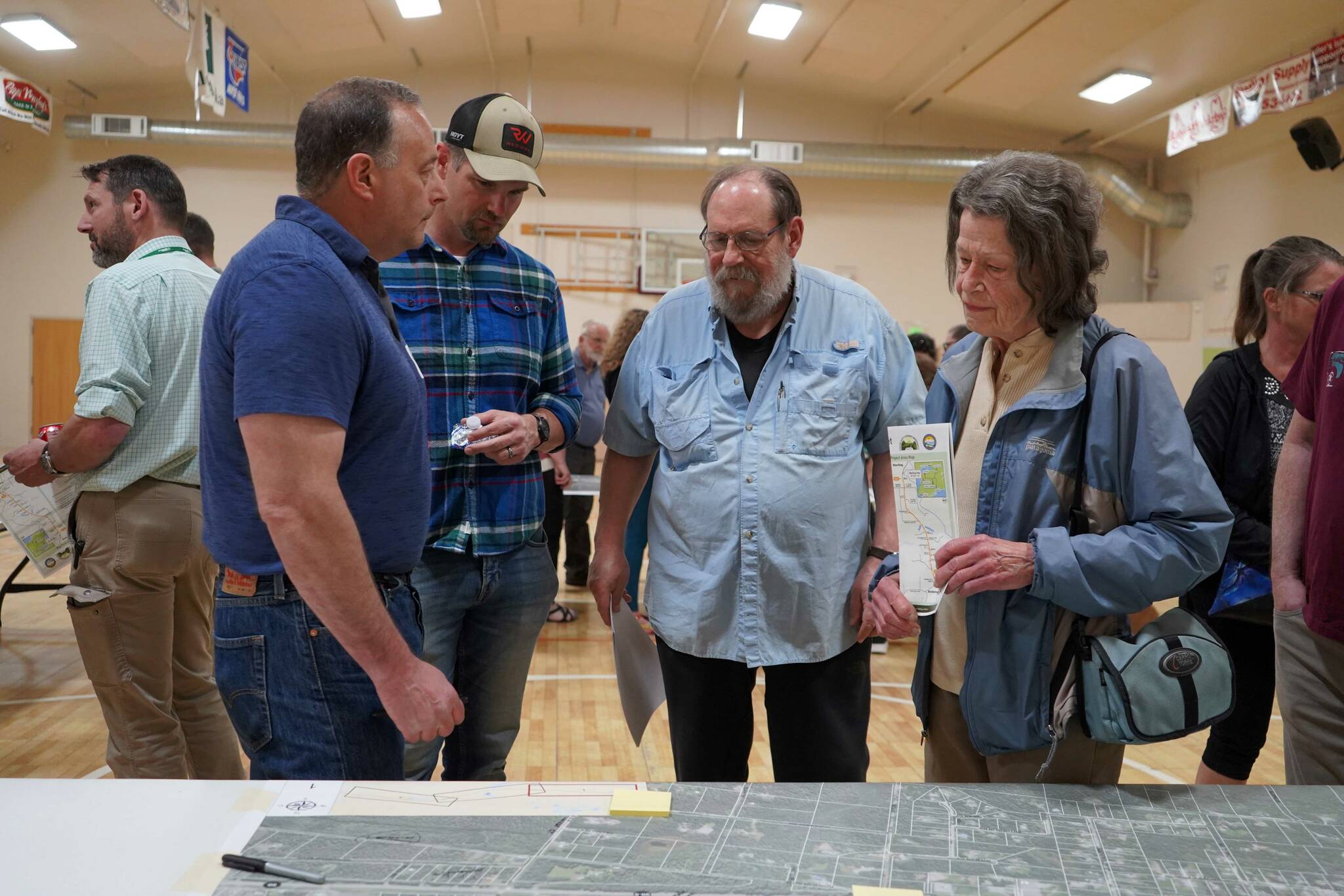 Project staff for the Sterling Safety Corridor Improvements project meet with residents, take feedback and answer questions during a town hall event at the Sterling Community Center in Sterling, Alaska, on Tuesday, June 25, 2024. (Jake Dye/Peninsula Clarion)