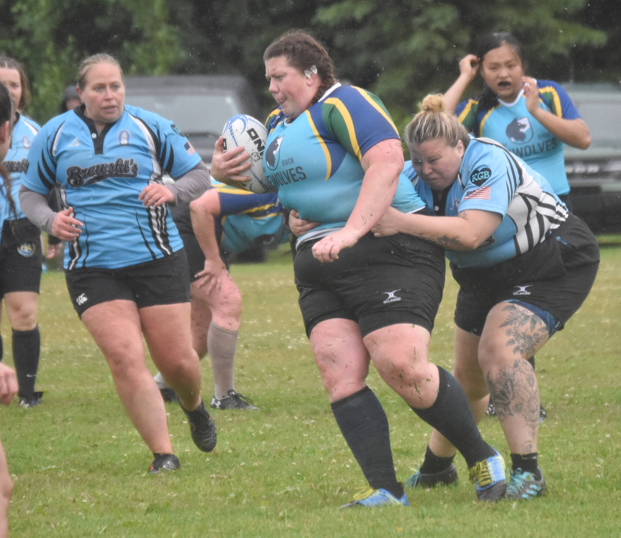 Sara “Tinks” Kolpack and Sabrina Bukvich of Scylla Rugby try to slow down Meredith Harber of the Kenai River SheWolves at the Kenai Dipnet Fest Rugby 10s Tournament on Saturday, July 13, 2024, in Kenai, Alaska. (Photo by Jeff Helminiak/Peninsula Clarion)