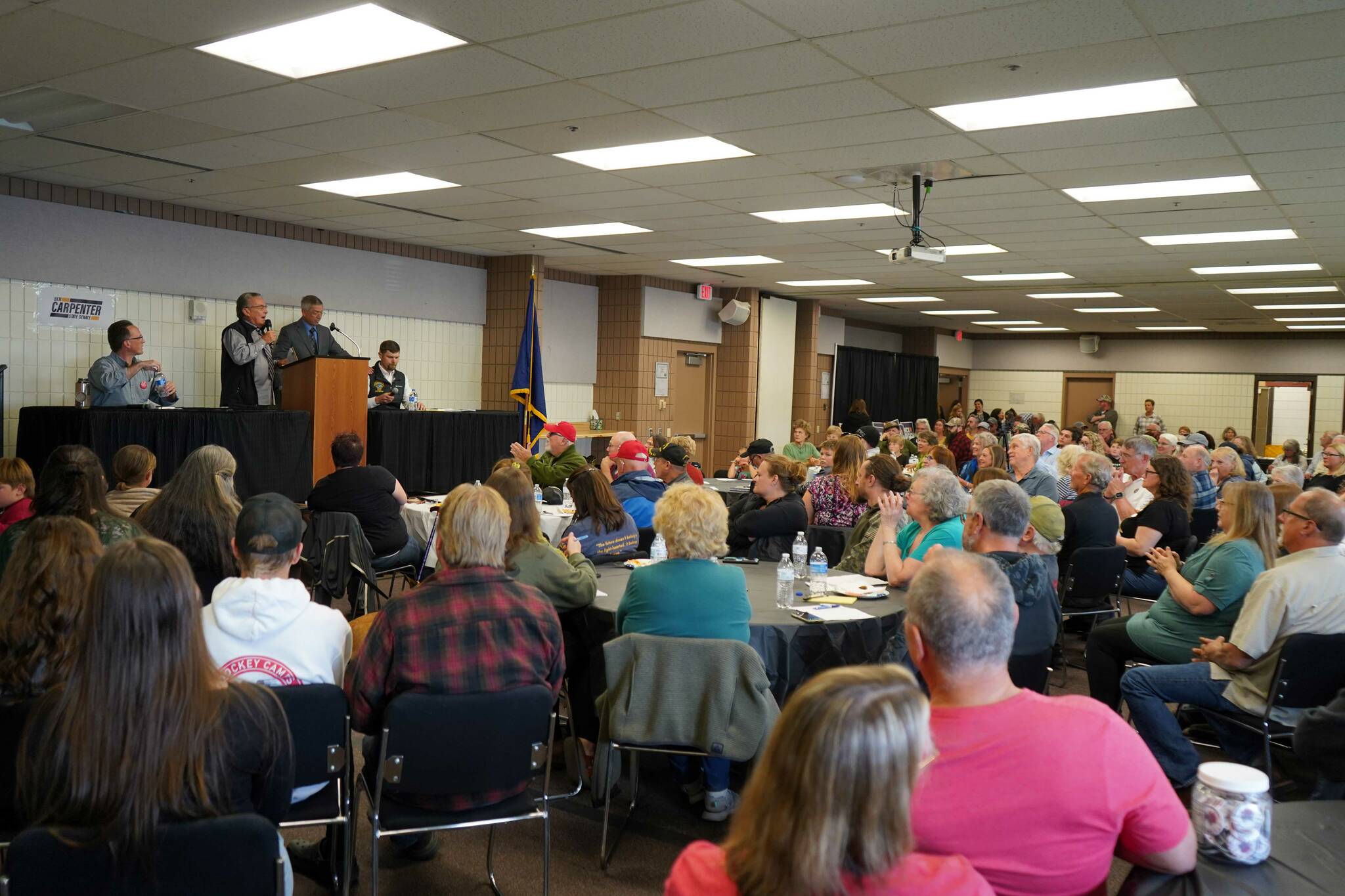 Moderator Merrill Sikorski and organizer Robert Wall introduce a debate between Rep. Ben Carpenter and Sen. Jesse Bjorkman, both R-Nikiski, organized by the District 8 Alaska Republican Party at the Soldotna Regional Sports Complex in Soldotna, Alaska, on Monday, Aug. 12, 2024. (Jake Dye/Peninsula Clarion)