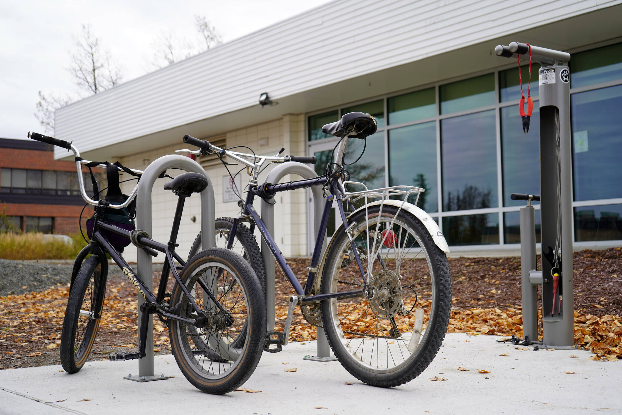 A bike rack and repair station are seen outside of the Kenai Community Library in Kenai, Alaska, on Thursday, Oct. 3, 2024. (Jake Dye/Peninsula Clarion)