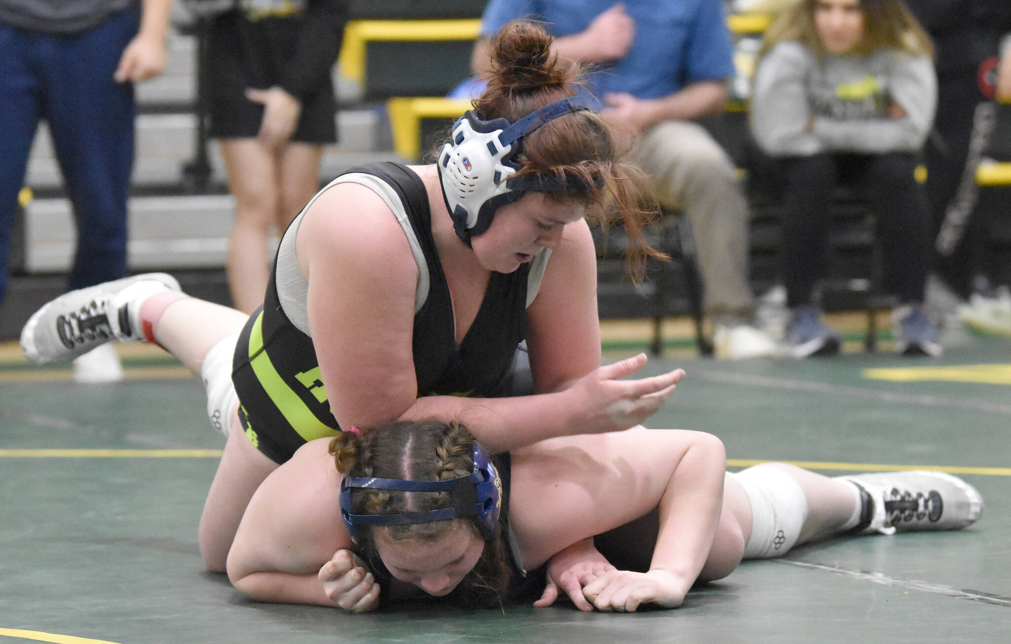 Redingtons Nikayla Miller wrestles to a victory over Homers Araya Andres in the championship match at 185 at the Kachemak Conference wrestling tournament at Seward High School in Seward, Alaska, on Saturday, Dec. 14, 2024. (Photo by Jeff Helminiak/Peninsula Clarion)