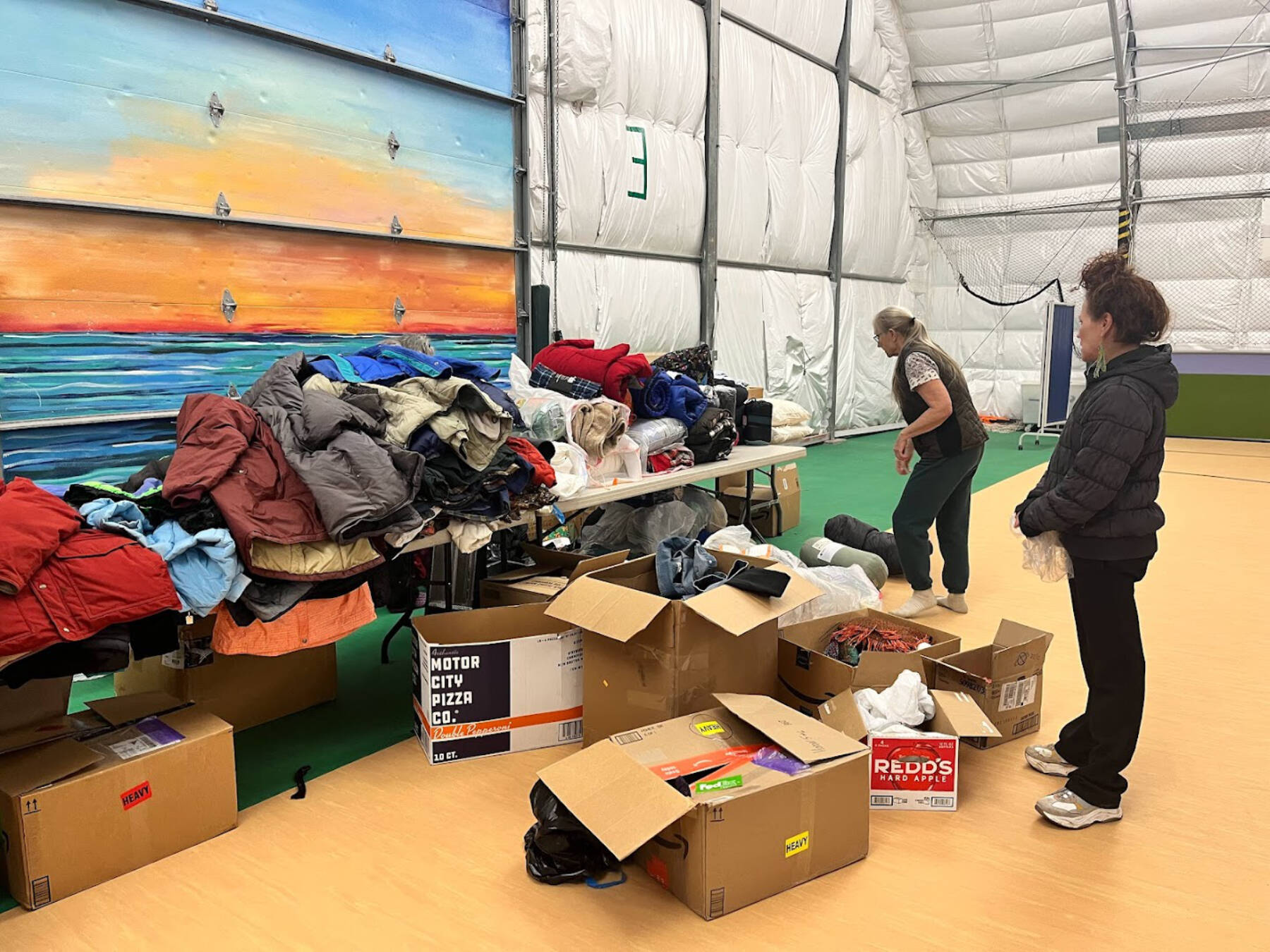 Volunteers sort winter gear prior to the start of the annual Community Resource Connect on Tuesday, Jan. 30, 2024, at the SPARC in Homer, Alaska. Photo provided by Derotha Ferraro