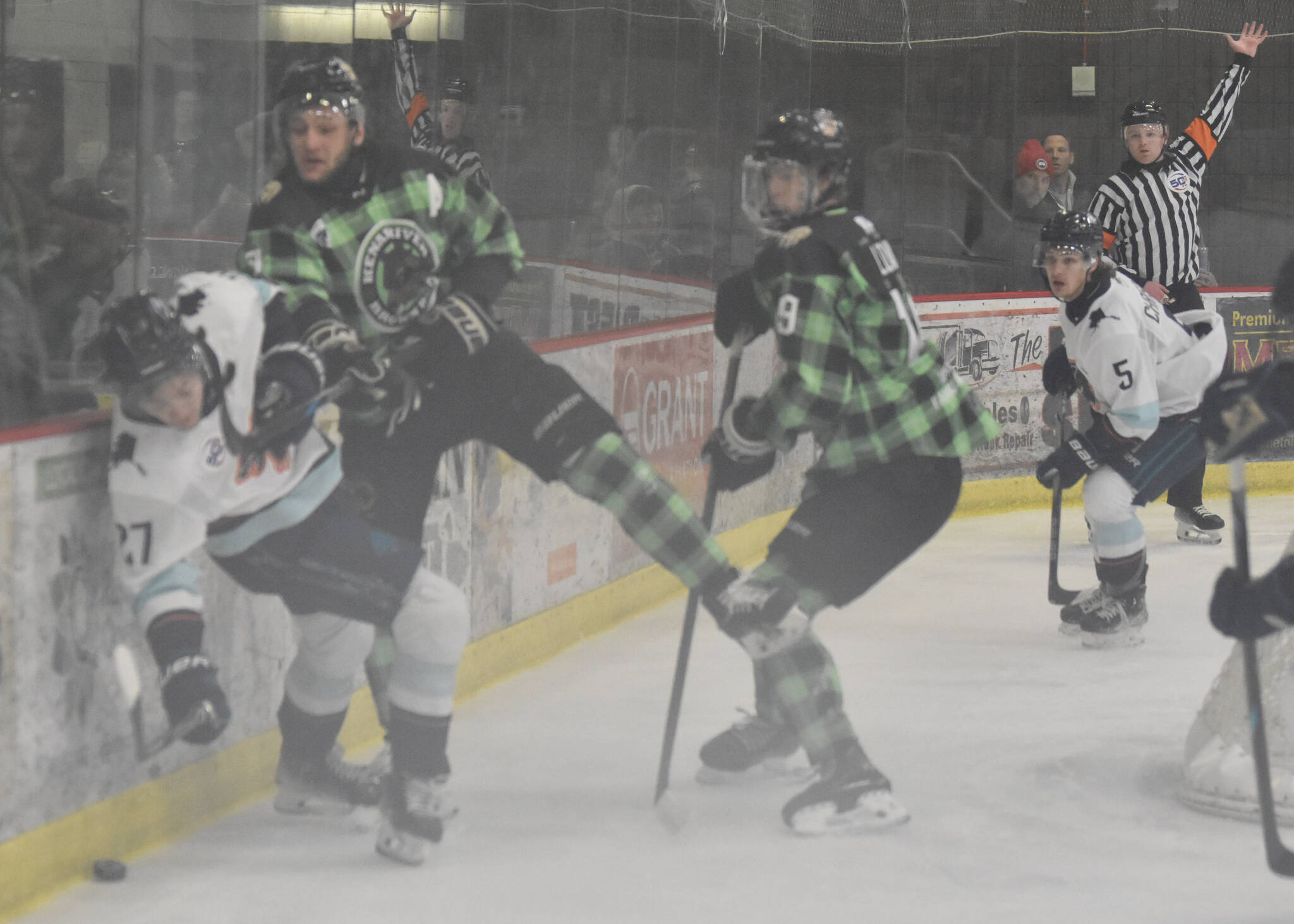 Riley Mullen of the Kenai River Brown Bears is called for high sticking on Daniel Bagnole of the Anchorage Wolverines on Saturday, Jan. 18, 2025, at the Soldotna Regional Sports Complex in Soldotna, Alaska. (Photo by Jeff Helminiak/Peninsula Clarion)