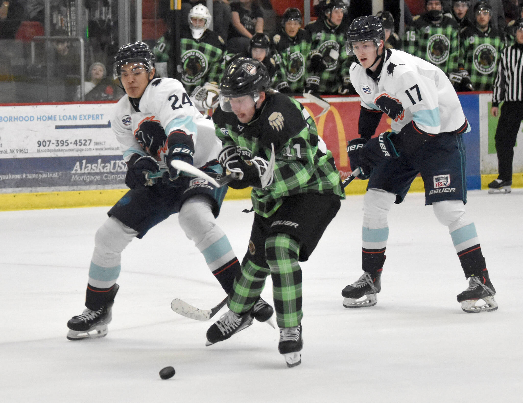 Wes Berg of the Kenai River Brown Bears earns a penalty shot in front of Jason Bourdukofsky of the Anchorage Wolverines on Saturday, Jan. 18, 2025, at the Soldotna Regional Sports Complex in Soldotna, Alaska. (Photo by Jeff Helminiak/Peninsula Clarion)