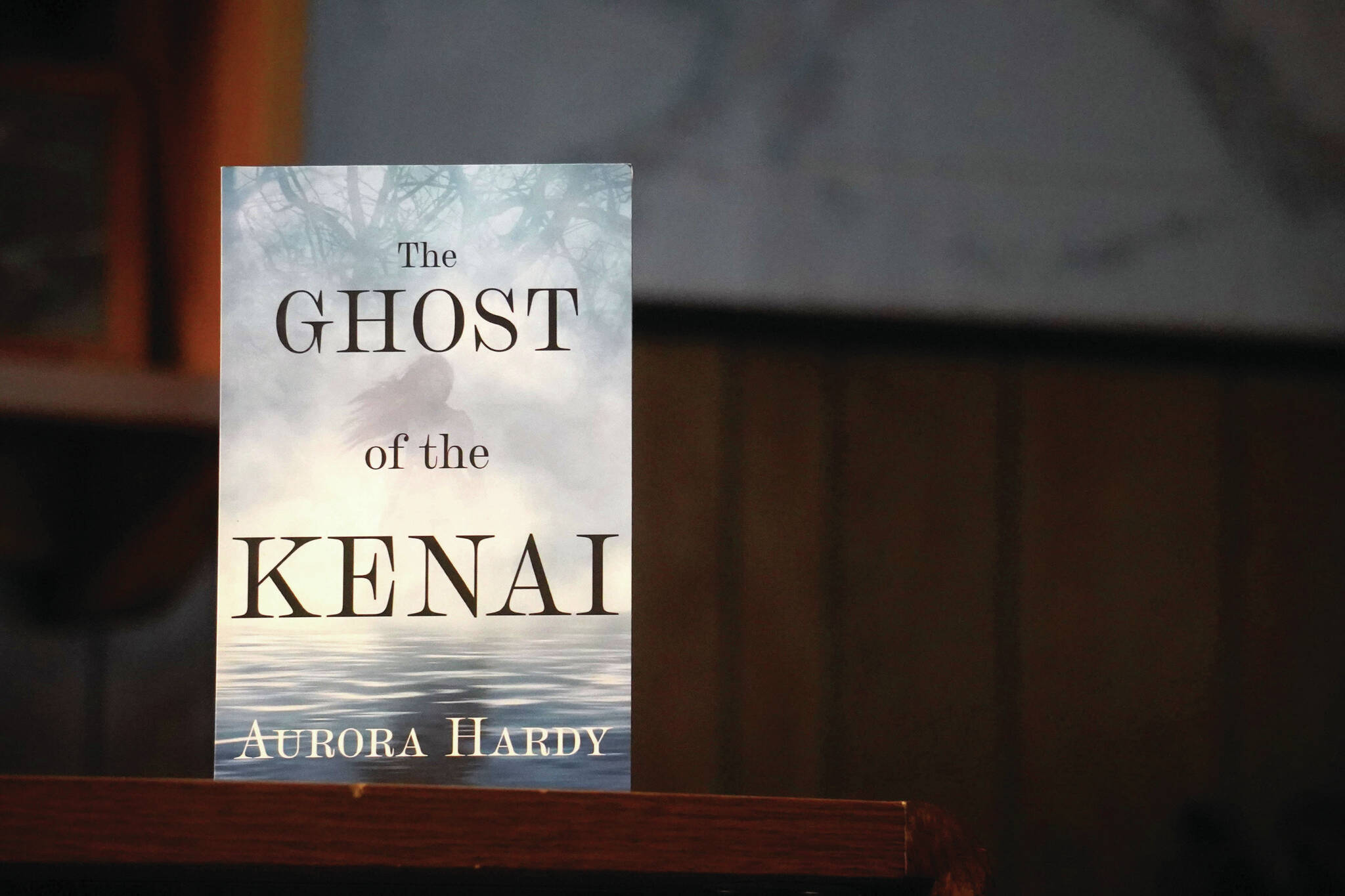 A copy of “The Ghost of the Kenai” stands on a desk in the Peninsula Clarion newsroom in Kenai on Tuesday,. (Jake Dye/Peninsula Clarion)