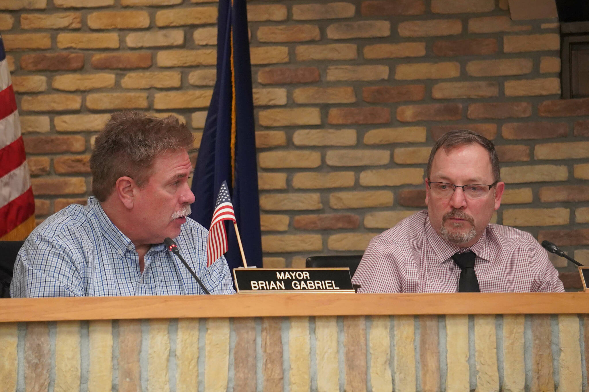 Kenai Mayor Brian Gabriel and City Manager Terry Eubank speak during a meeting of the Kenai City Council in Kenai, Alaska, on Wednesday, Jan. 15, 2025. (Jake Dye/Peninsula Clarion)