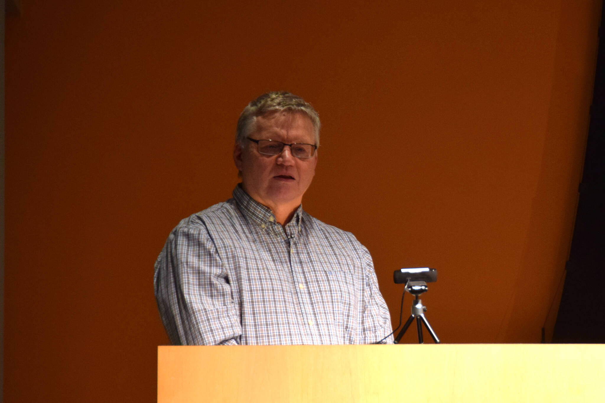Steve Delehanty, the former manager of the Alaska Maritime National Wildlife Refuge Visitor Center, addresses a crowd gathered to celebrate his public service on Tuesday, Jan. 21. (Chloe Pleznac/Homer News)