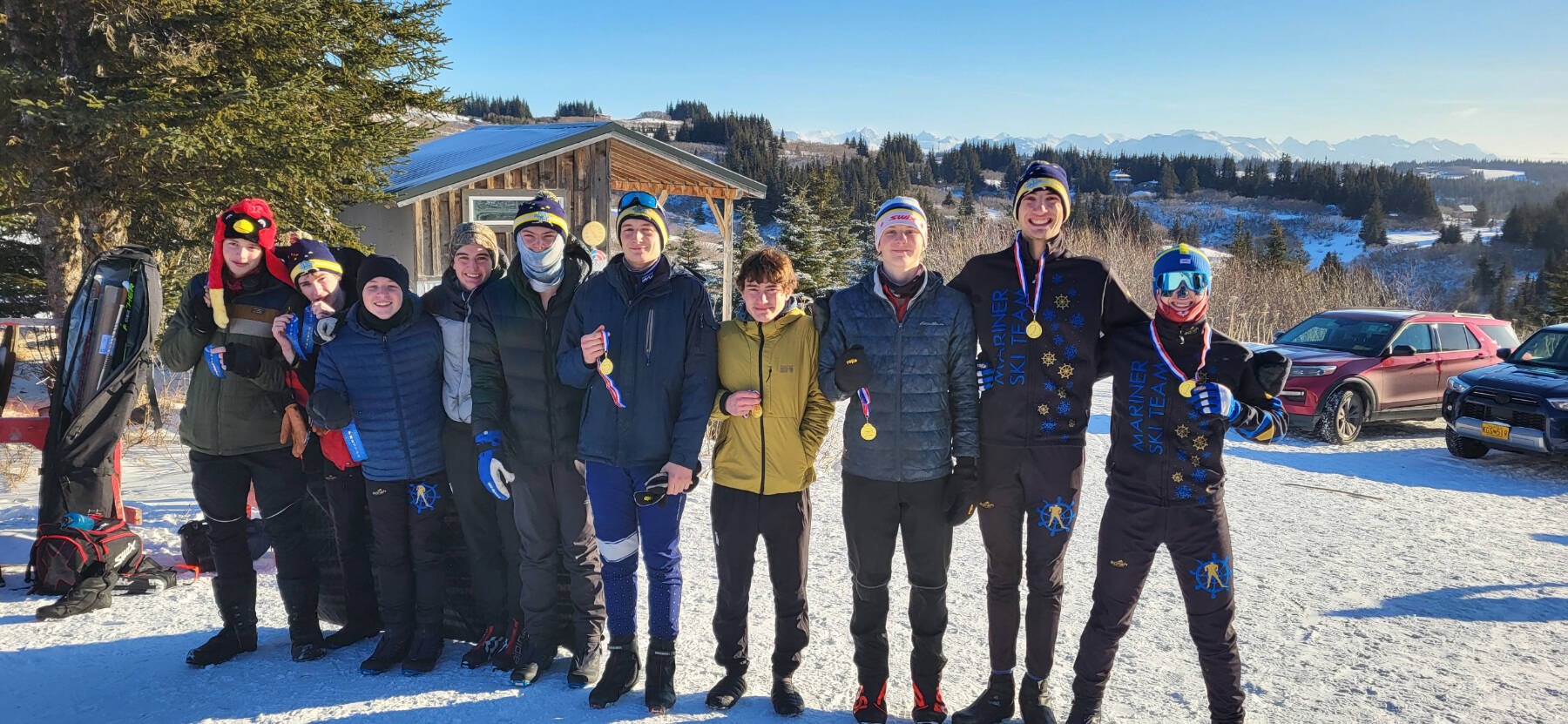 The Homer High School Boys Nordic Ski Team holds up their wins for the day at the Lookout Mountain Cross-Country Ski Trails on Thursday, Jan. 30, 2025 in Homer, Alaska. Homer’s Jody Goodrich and Johannes Bynagle placed first and second for the Varsity boys, respectively. (Chloe Pleznac/Homer News)