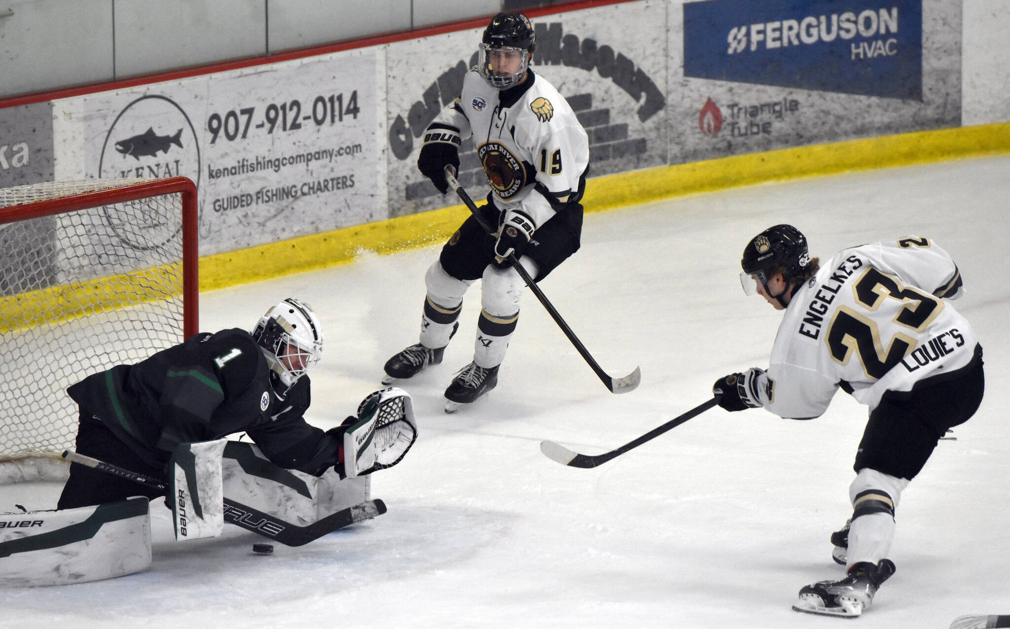 Brady Engelkes of the Kenai River Brown Bears scores off an assist from Luke Lizak (19) on Minnesota Wilderness goalie Niklas Erickson on Saturday, Feb. 1, 2025, at the Soldotna Regional Sports Complex in Soldotna, Alaska. (Photo by Jeff Helminiak/Peninsula Clarion)