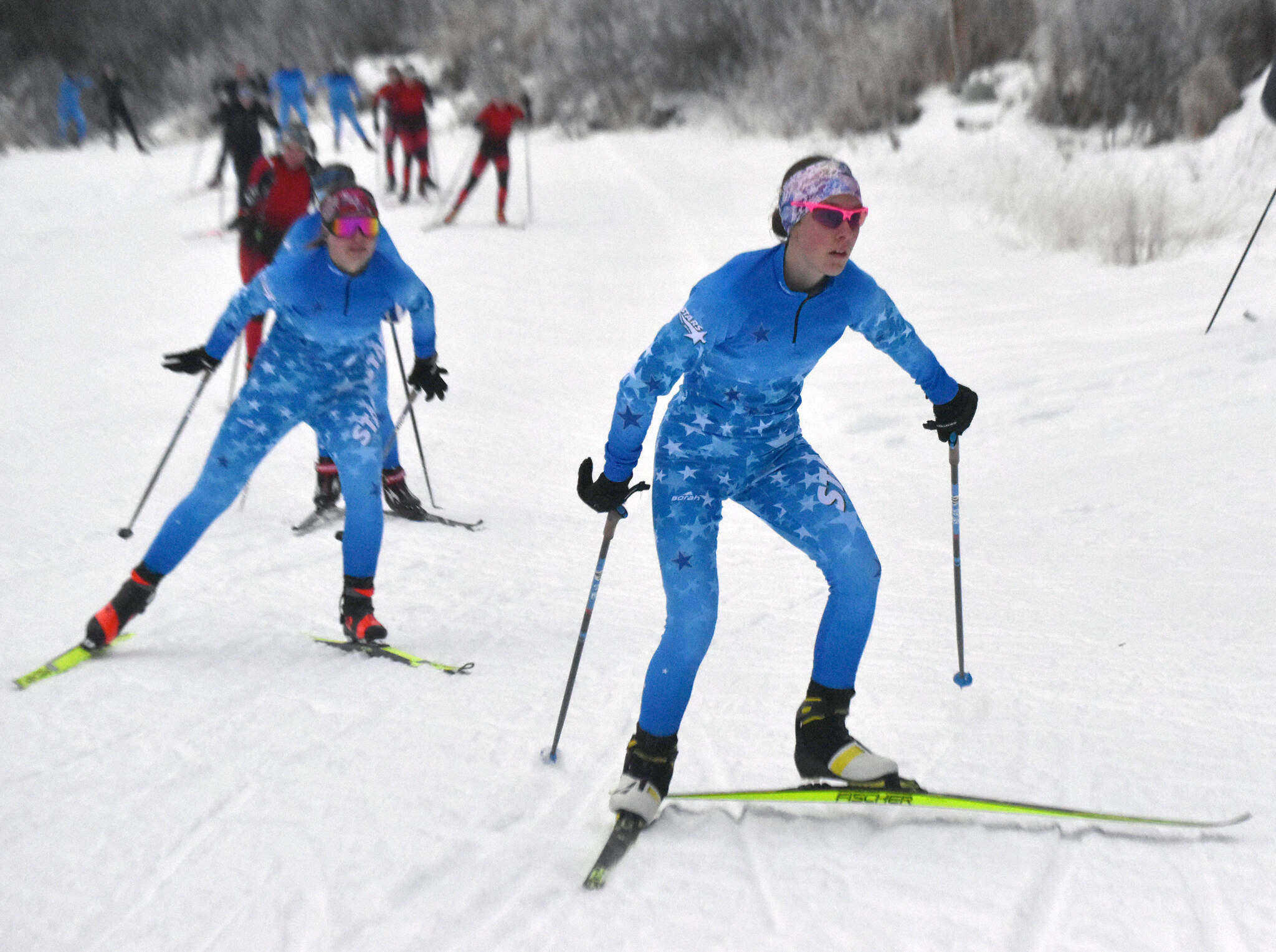 Soldotna's Tania Boonstra leads Soldotna's Ariana Cannava and the rest of the pack at the girls varsity race of the Turkey Skate on Tuesday, Nov. 26, 2024, at Tsalteshi Trails just outside of Soldotna, Alaska. (Photo by Jeff Helminiak/Peninsula Clarion)