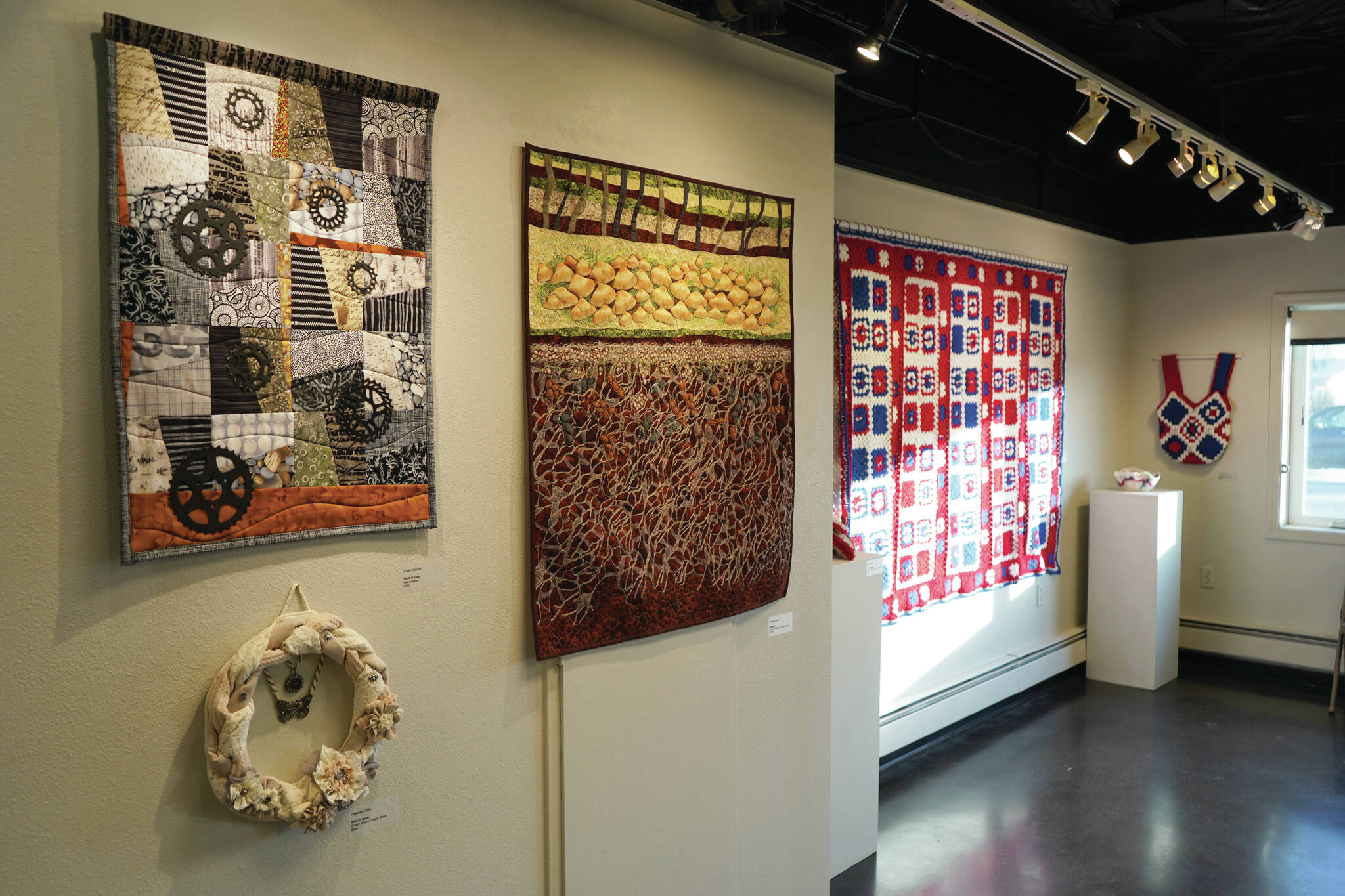Jake Dye/Peninsula Clarion
Artwork by Susan Nabholz, Charlotte Coots and Chelline Larsen is displayed as part of “Fiber” at the Kenai Art Center on Wednesday.