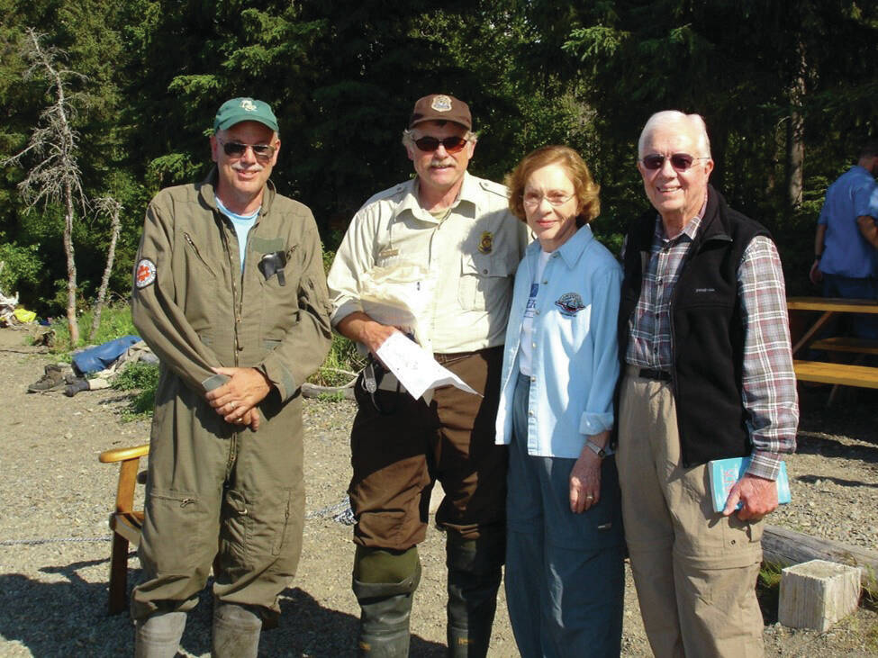 Left to right: Tom Griffiths, former Denali National Park chief ranger and refuge volunteer; Rick Johnston, Kenai National Wildlife Refuge pilot/ranger; Rosalynn Carter and former President Jimmy Carter are photographed at Alaska Wildland Adventures Kenai Back Country Lodge beach, Skilak Lake, Kenai National Wildlife Refuge<ins>,</ins> <ins>Alaska</ins>. (Photo by Kirk Hoessle/courtesy)