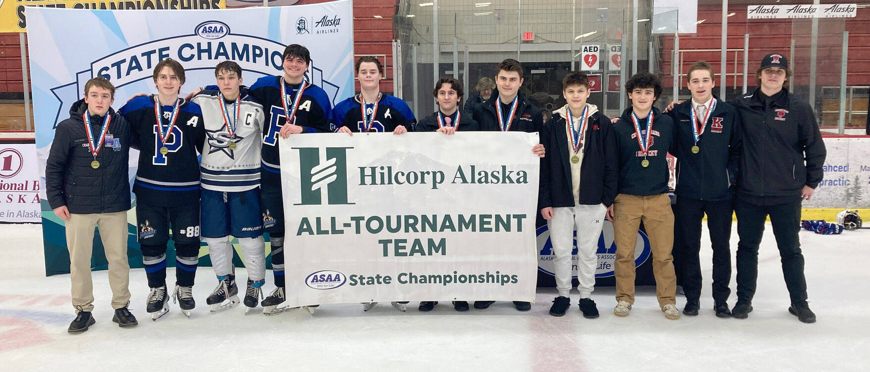The all-tournament team at the First National Cup Division II state hockey tournament Saturday, February 8, 2025, at the Soldotna Regional Sports Complex in Soldotna, Alaska. From left to right are Soldotna’s Noah Crabtree, Palmer’s Kinan Greco, Soldotna’s Daniel Heath, Palmer’s Elijah Von Gunten, Palmer’s Bryce Horacek, Kenai’s Logan Mese, Houston’s Daniel Matveev, Houston’s Zasim Konev, Juneau-Douglas’ Dylan Sowa, Kenai’s Evyn Witt and Juneau-Douglas’ Lucas Bovitz. (Photo by Jeff Helminiak/Peninsula Clarion)