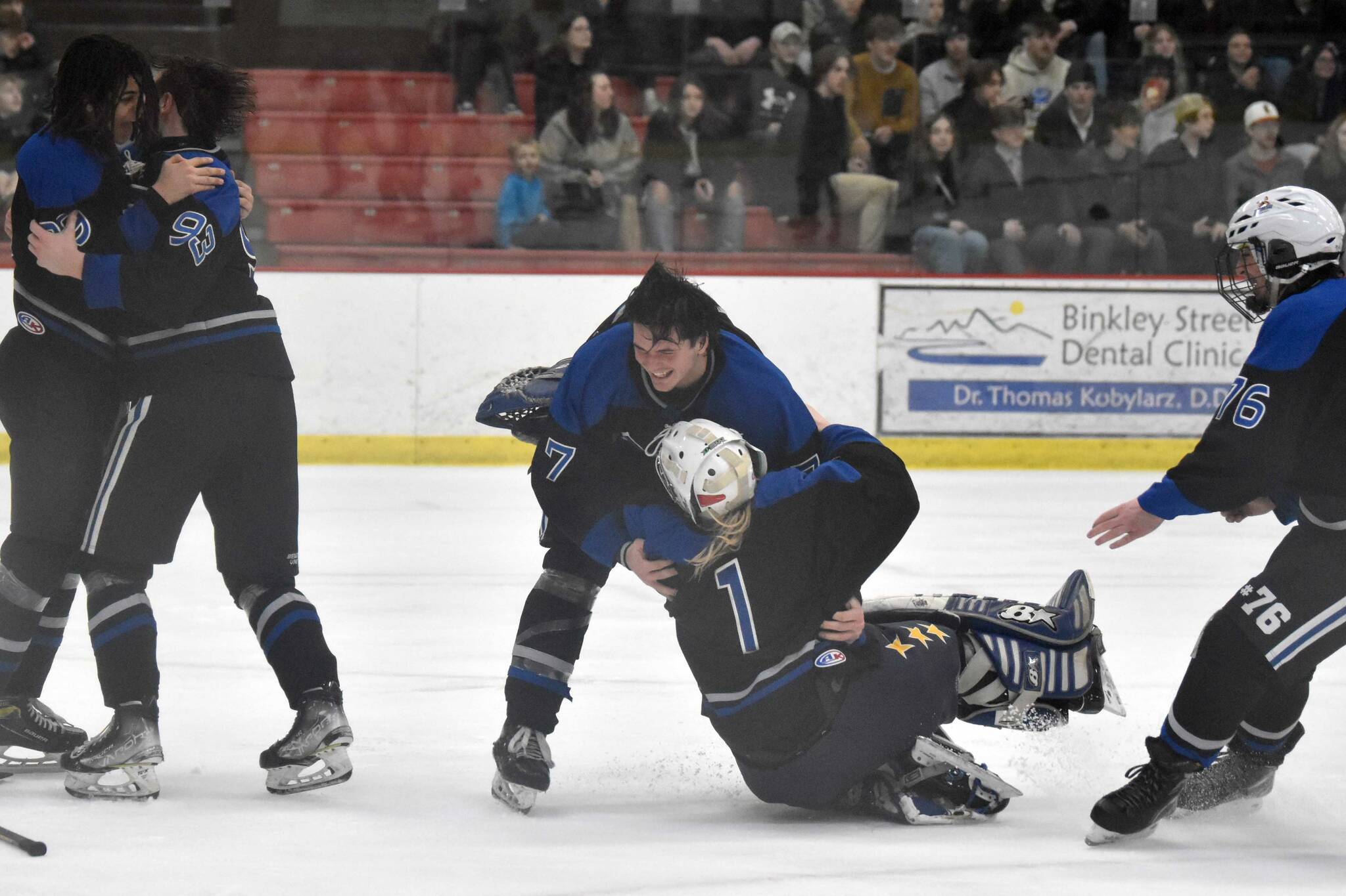Palmer mobs goalie Emily Christman after defeating Soldotna for the championship at the First National Cup Division II state hockey tournament Saturday, February 8, 2025, at the Soldotna Regional Sports Complex in Soldotna, Alaska. (Photo by Jeff Helminiak/Peninsula Clarion)