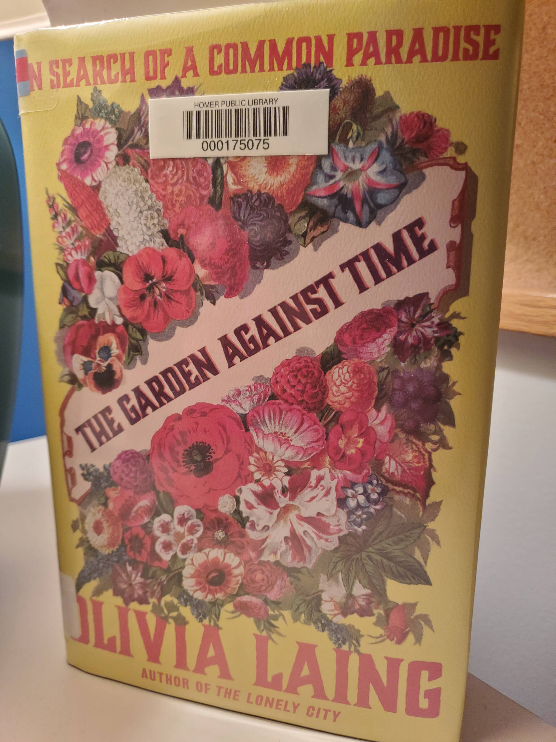 “The Garden Against Time” by Olivia Laing stands on a desk in the Homer News newsroom on Tuesday, Feb. 11, 2025, in Homer, Alaska. (Delcenia Cosman/Homer News)