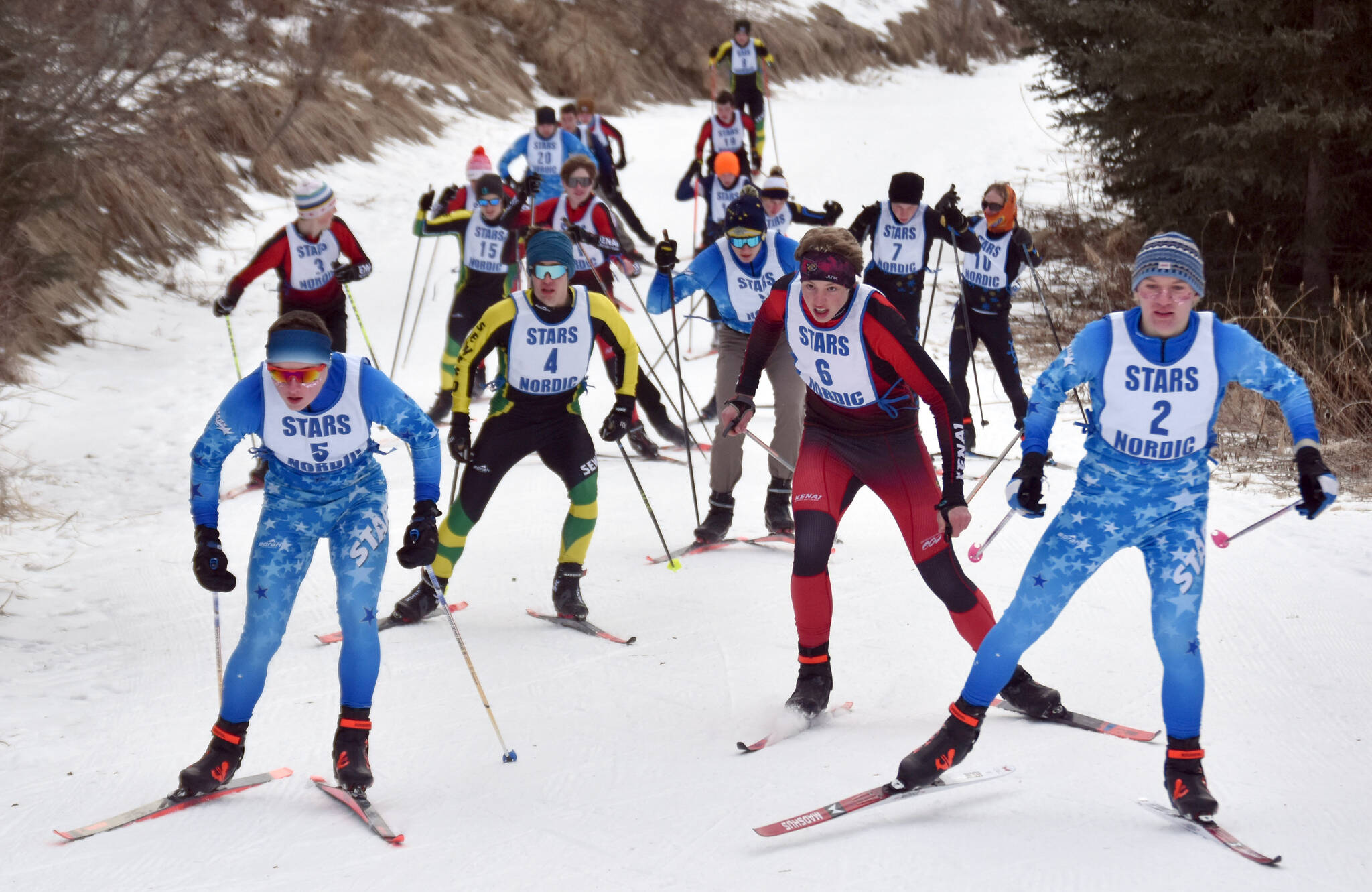 Soldotna’s Michael Davidson and Ollie Dahl lead the varsity pack up the hill in the 4-kilometer boys race at the Kenai Peninsula Borough meet Saturday, February 15, 2025, at Tsalteshi Trails just outside of Soldotna, Alaska. (Photo by Jeff Helminiak/Peninsula Clarion)