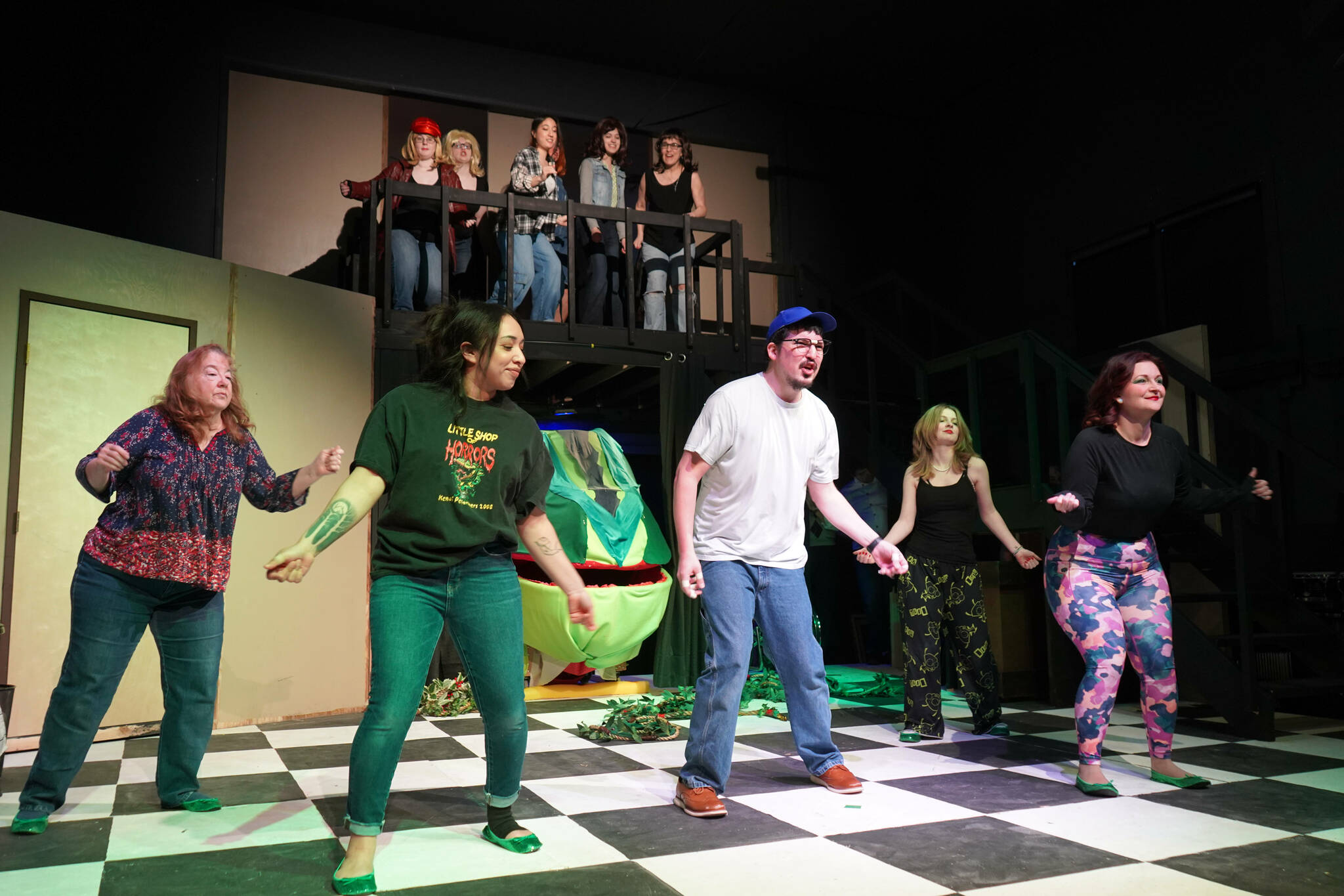 The cast of the Kenai Performers’ “Little Shop of Horrors” rehearse at the Kenai Performers Theater near Soldotna, Alaska, on Saturday, Feb. 15, 2025. (Jake Dye/Peninsula Clarion)