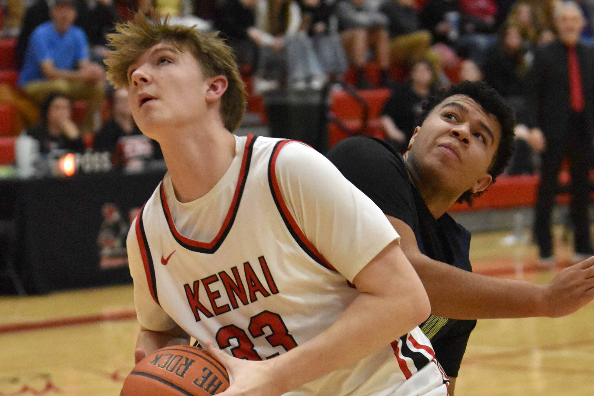 Kenai Central's Mason Tunseth goes up for a shot against Redington's Aiden Dobbs on Thursday, February 27, 2025, at Kenai Central High School in Kenai, Alaska. (Photo by Jeff Helminiak/Peninsula Clarion)
