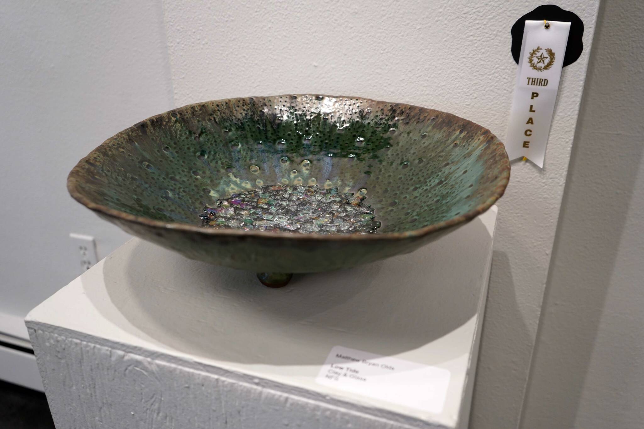 “Low Tide” by Matthew Bryan Olds is displayed with a third-place ribbon during the opening reception for “Infusion” at the Kenai Art Center in Kenai, Alaska, on Friday, March 7, 2025. (Jake Dye/Peninsula Clarion)