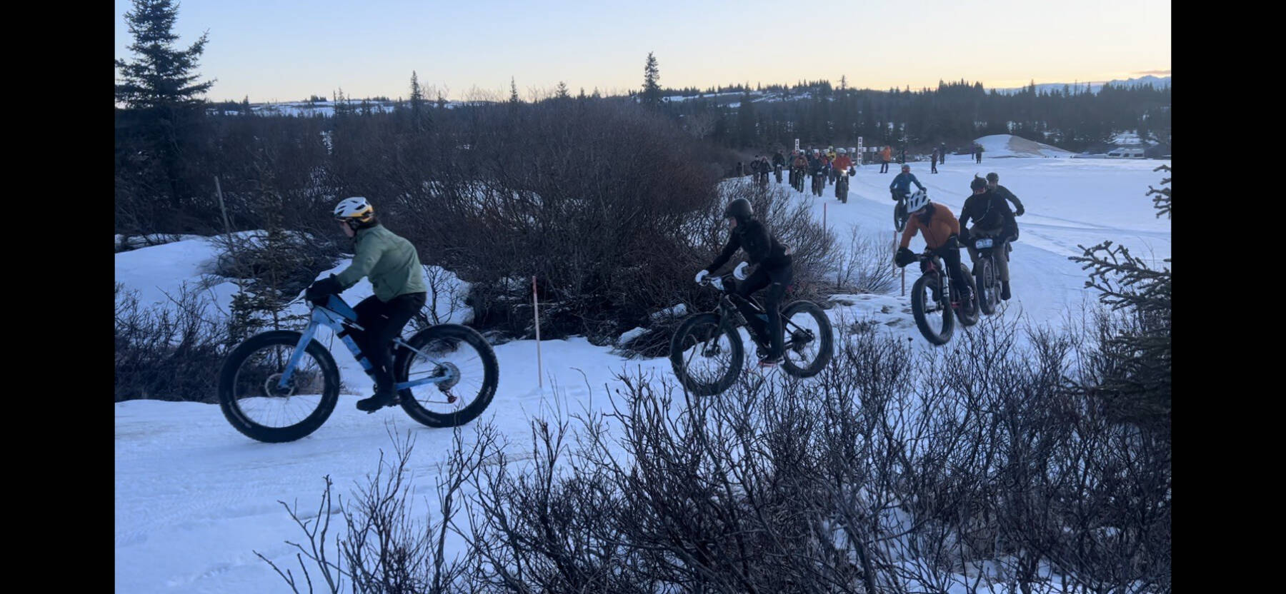 Bicyclists race around a corner during the 2025 Homer Epic fundraiser for the Homer Cycling Club. (Photo courtesy of Jake Schlapfer)