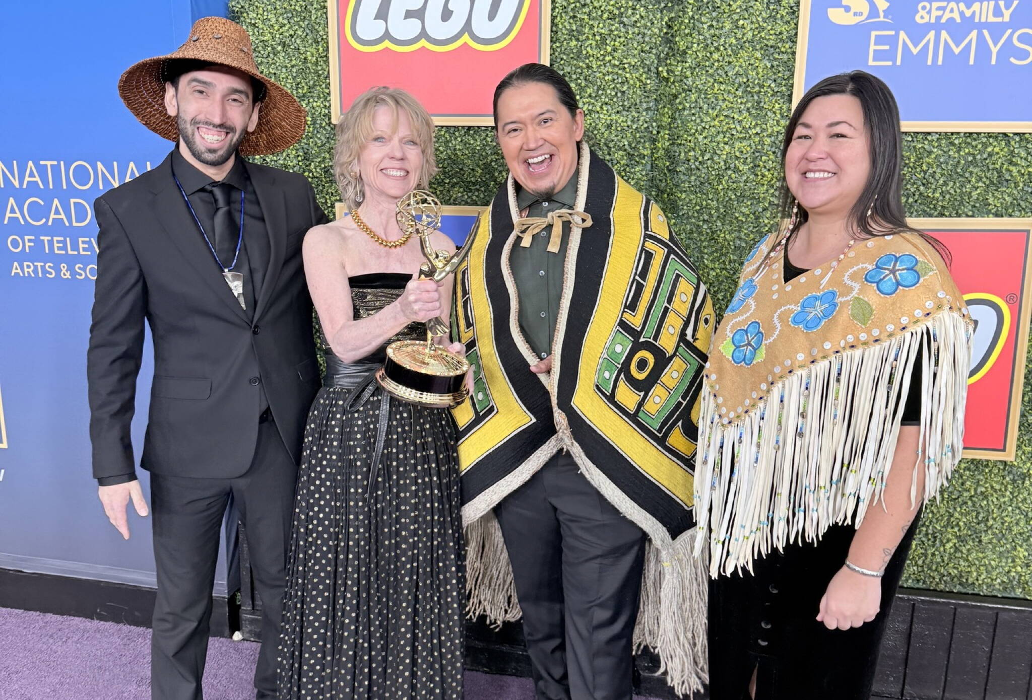 ‘Wáats’asdiyei Joe Yates, Raye Lankford, X̱’unei Lance Twitchell and Rochelle Adams pose with the Children’s and Family Emmy Award award Lankford and Twitchell won for co-writing the an episode of the PBS animated children’s show “Molly of Denali.” (Photo courtesy of ‘Wáats’asdiyei Joe Yates)