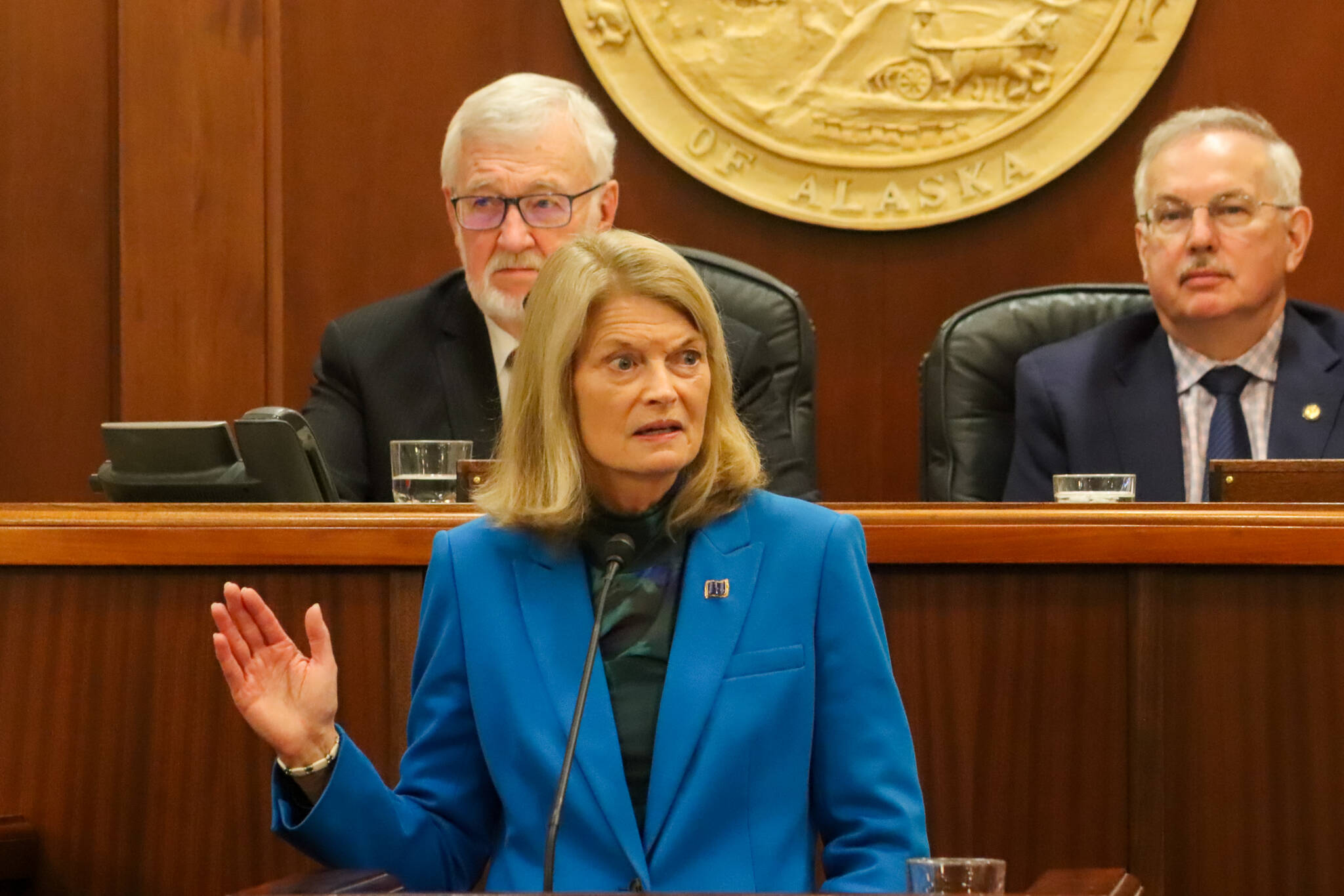 U.S. Sen. Lisa Murkowski raises her right hand to demonstrate the oath she took when sworn in while answering a question about her responsibility to defend the U.S. Constitution during her annual address to the Alaska Legislature on March 18, 2025. (Jasz Garrett / Juneau Empire)