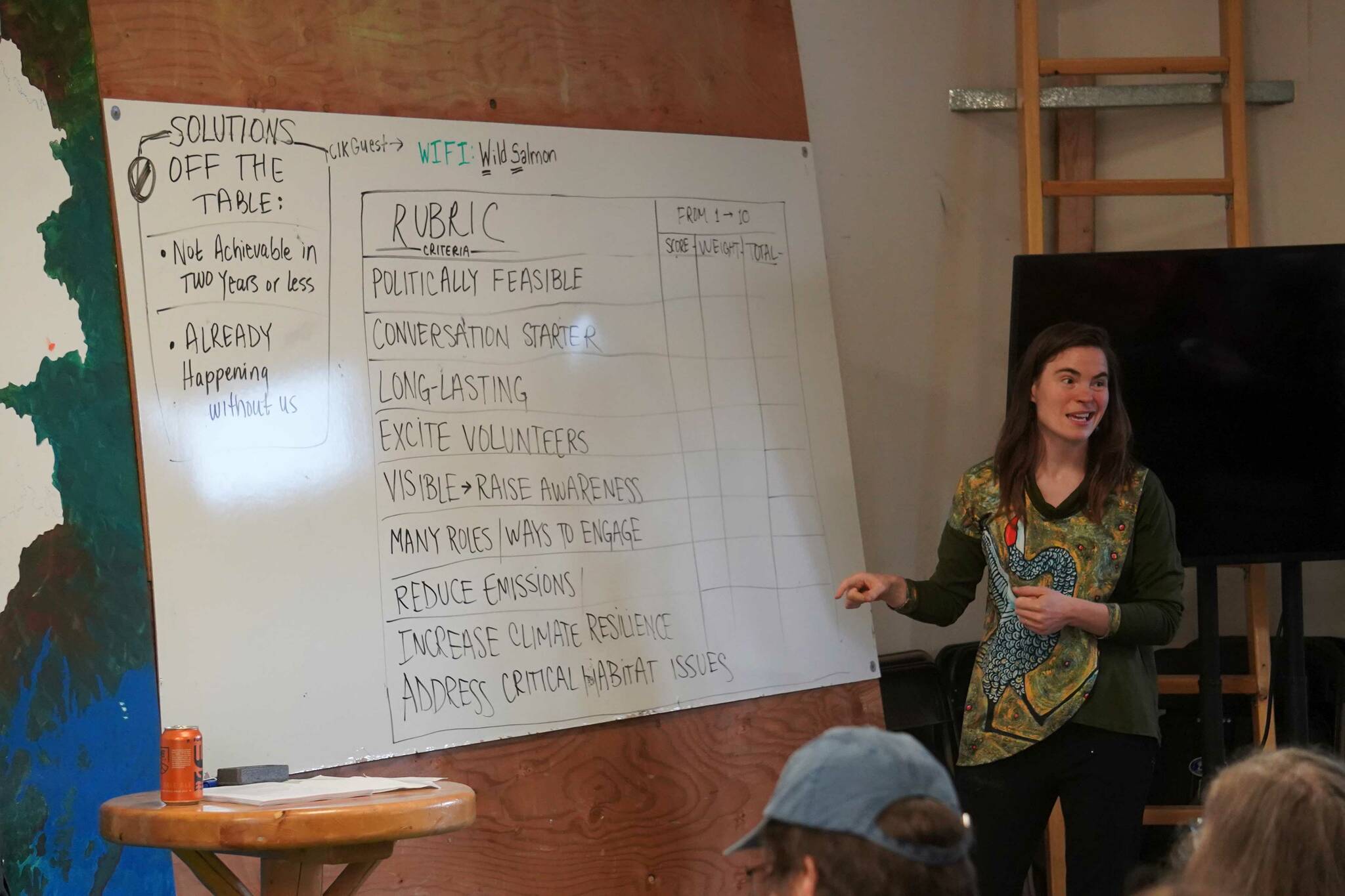 Cook Inletkeeper Central Peninsula Regional Director Kaitlin Vadla speaks during a Local Solution meeting focused on salmon at the Cook Inletkeeper Community Action Studio in Soldotna, Alaska, on Thursday, March 20, 2025. (Jake Dye/Peninsula Clarion)