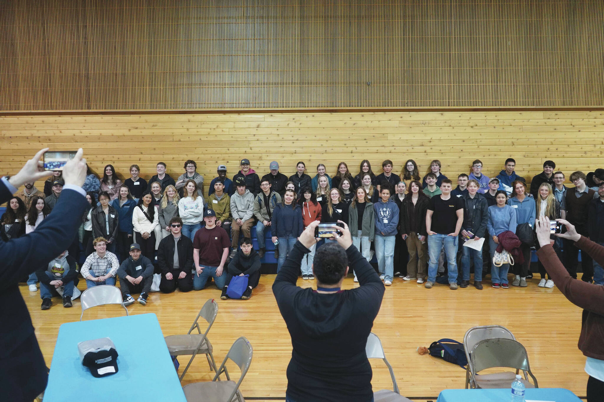 Students and hosts stand for a photo during a luncheon at the end of SoHi’s first Job Shadow Day, Wednesday at Soldotna Prep School. (Jake Dye/Peninsula Clarion)