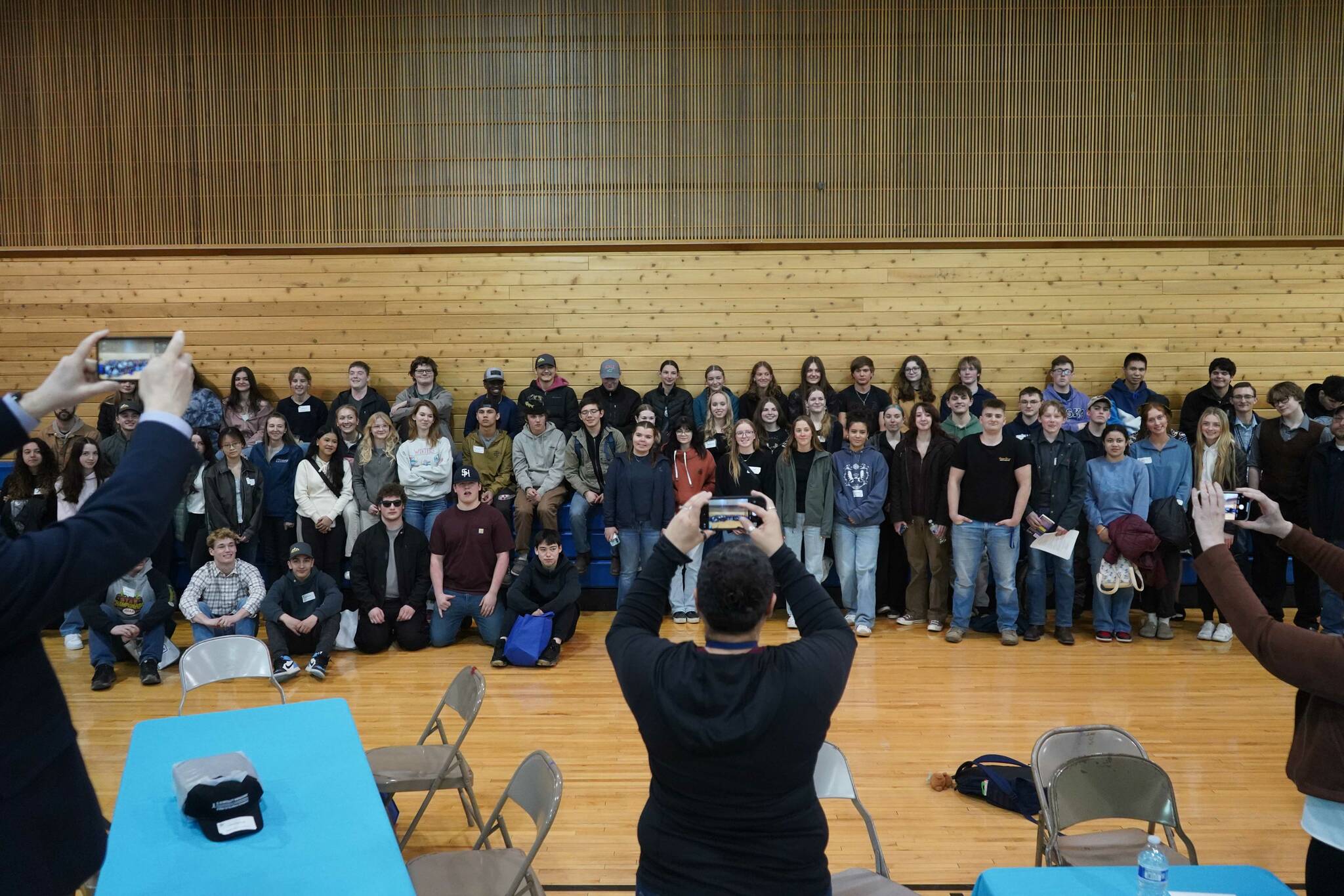Students and hosts stand for a photo during a luncheon at the end of SoHi’s first Job Shadow Day, Wednesday, March 26, 2025, at Soldotna Prep School in Soldotna, Alaska. (Jake Dye/Peninsula Clarion)