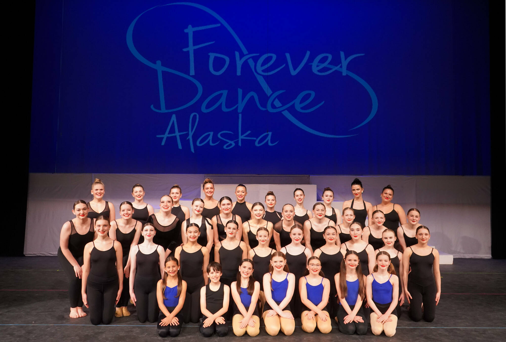 Dancers appear for a photo during a rehearsal of Forever Dance’s 10th Anniversary Company Showcase, “Down Memory Lane,” at Kenai Central High School in Kenai, Alaska, on Wednesday, March 26, 2025. (Jake Dye/Peninsula Clarion)