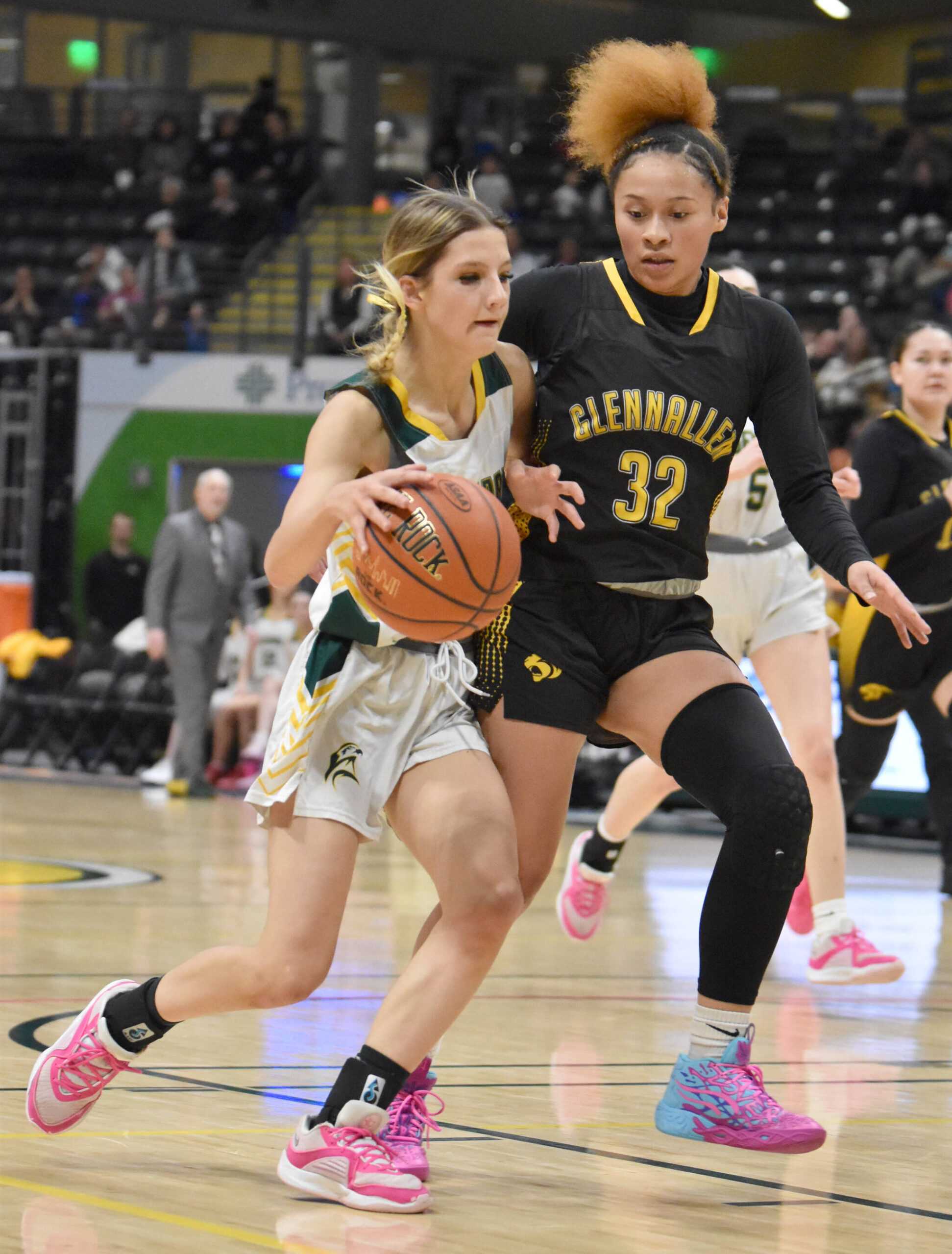 Seward’s Ava Jagielski drives on Glennallen’s Brejanay Stone-Jordan at the Class 2A girls state championship game Saturday, March 15, 2025, at the Alaska Airlines Center in Anchorage, Alaska. (Photo by Jeff Helminiak/Peninsula Clarion)