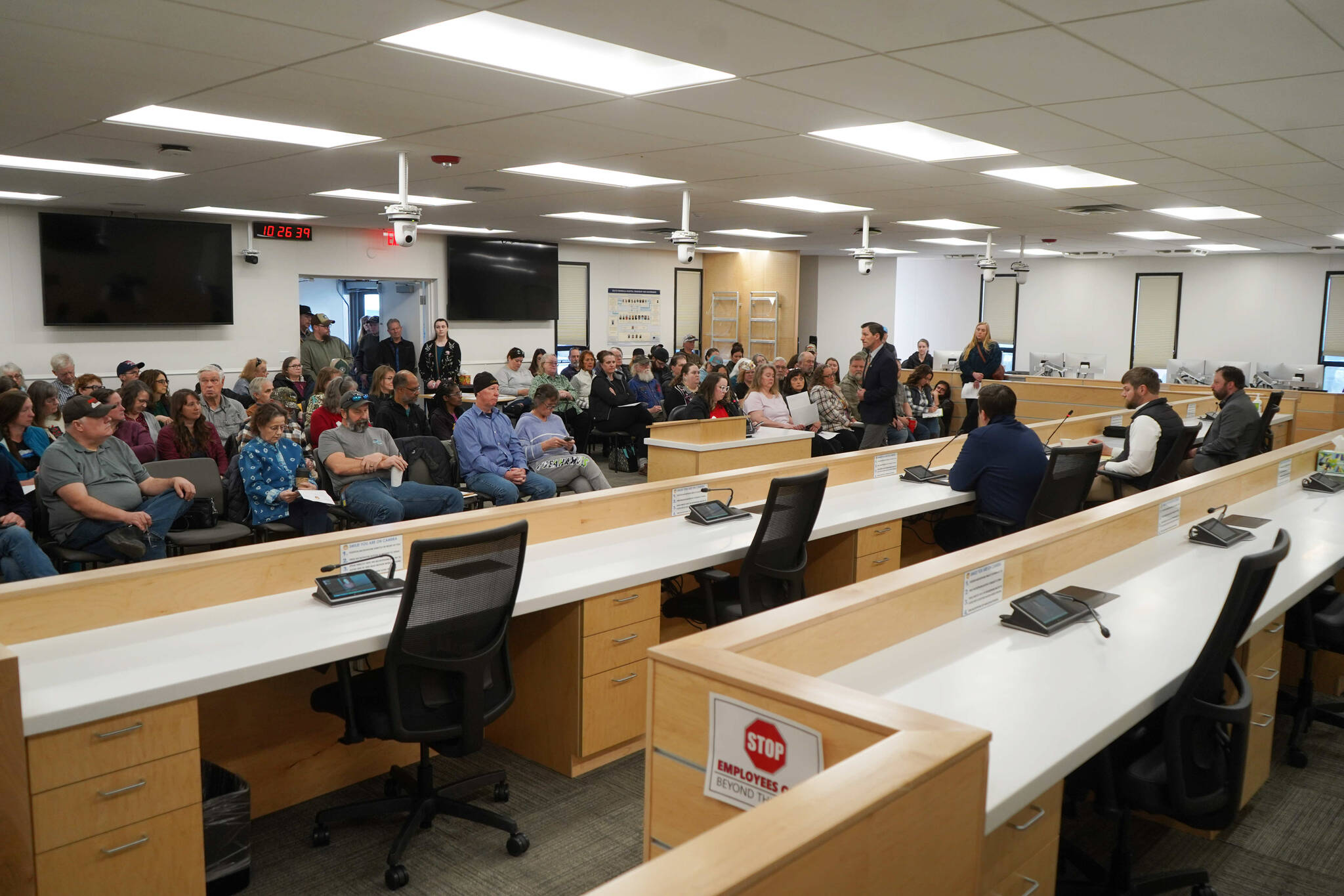 Seats are filled and people watch from the entryway during a town hall meeting hosted by three Kenai Peninsula legislators in the Kenai Peninsula Borough Assembly Chambers in Soldotna, Alaska, on Saturday, March 29, 2025. (Jake Dye/Peninsula Clarion)