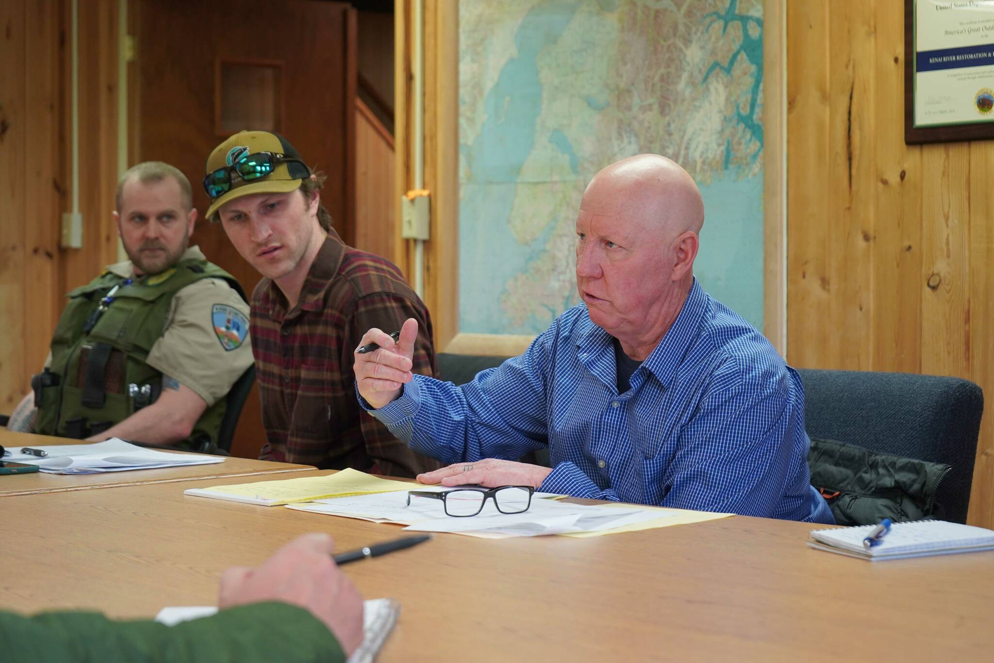 Greg Brush, right, speaks during an emergency meeting of the Kenai River Special Management Area Advisory Board’s guide committee at the Kenai Peninsula Region Office of Alaska State Parks near Soldotna, Alaska, on Feb. 25, 2025. (Jake Dye/Peninsula Clarion)
