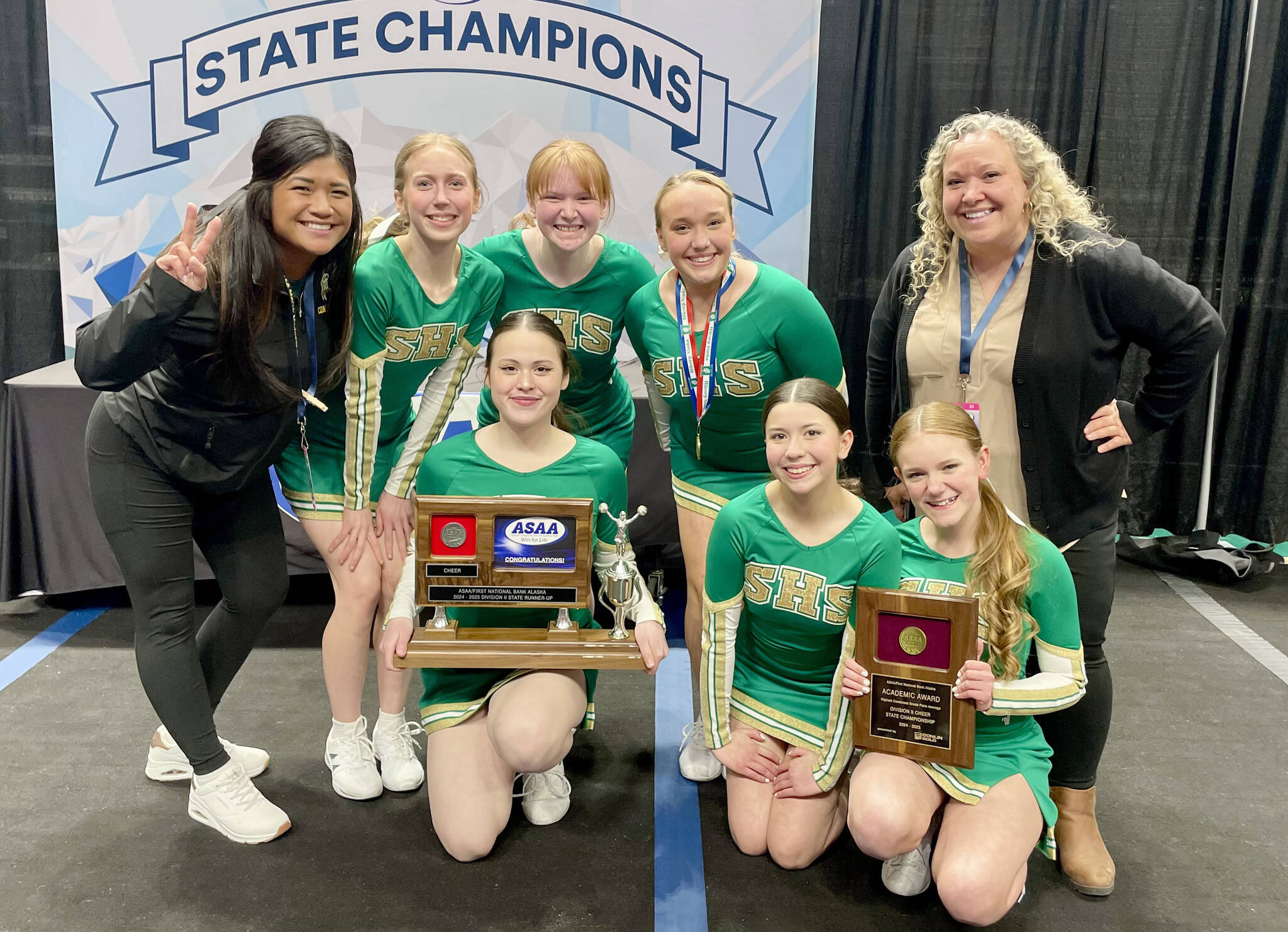 The Seward cheerleading team. From left to right are head coach Jean Beck, freshman Sophia Hughes, junior Somi Clendaniel, junior co-captain Juniper Ingalls, junior captain Lola Swanson, sophomore Josie Andrews, sophomore Addison Gerlach and assistant coach Brittany Swanson. (Photo provided)