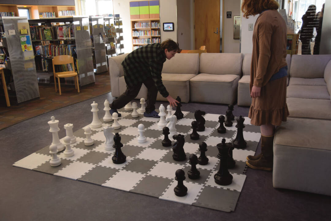 Youth play an epic game of chess during the Celebration of Lifelong Learning at Homer Public Library on Saturday, March 29, 2025. (Chloe Pleznac/Homer News)