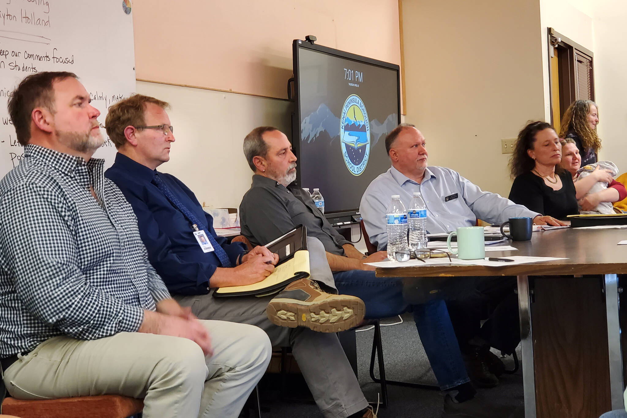 From left: Kenai Peninsula Borough School District Superintendent Clayton Holland; Director of Elementary Education Eric Pederson; board president Zen Kelly; Director of Planning and Operations Kevin Lyon; and Assistant Superintendent Kari Dendurent hear questions and concerns from Nikolaevsk parents, staff and students during a community meeting in the school library on Thursday, April 3, 2025, in Nikolaevsk, Alaska. (Delcenia Cosman/Homer News)