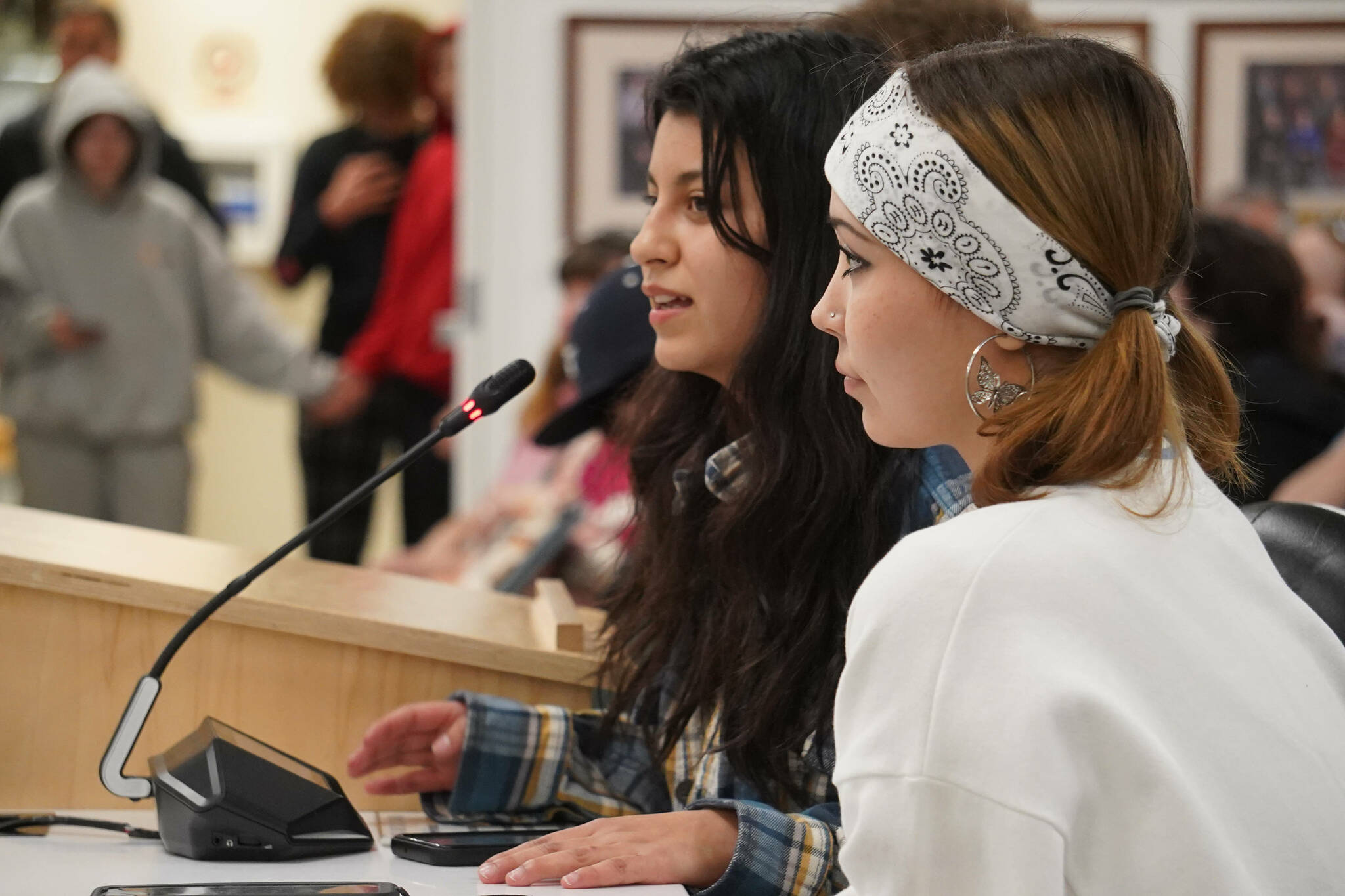 Stefany Montague and Georgia Christmas, students of Kenai Alternative High School, speak during a meeting of the Kenai Peninsula Borough School District’s Board of Education in Soldotna, Alaska, on Monday, April 7, 2025. (Jake Dye/Peninsula Clarion)
