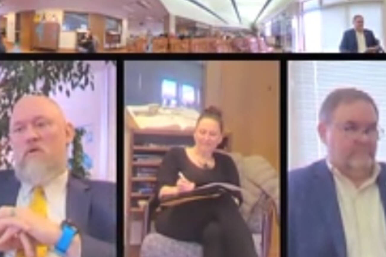 A screenshot of a Zoom meeting where Superintendent Clayton Holland (right) interviews Dr. Henry Burns (left) on Wednesday, April 9, while Assistant Superintendent Kari Dendurent (center) takes notes.