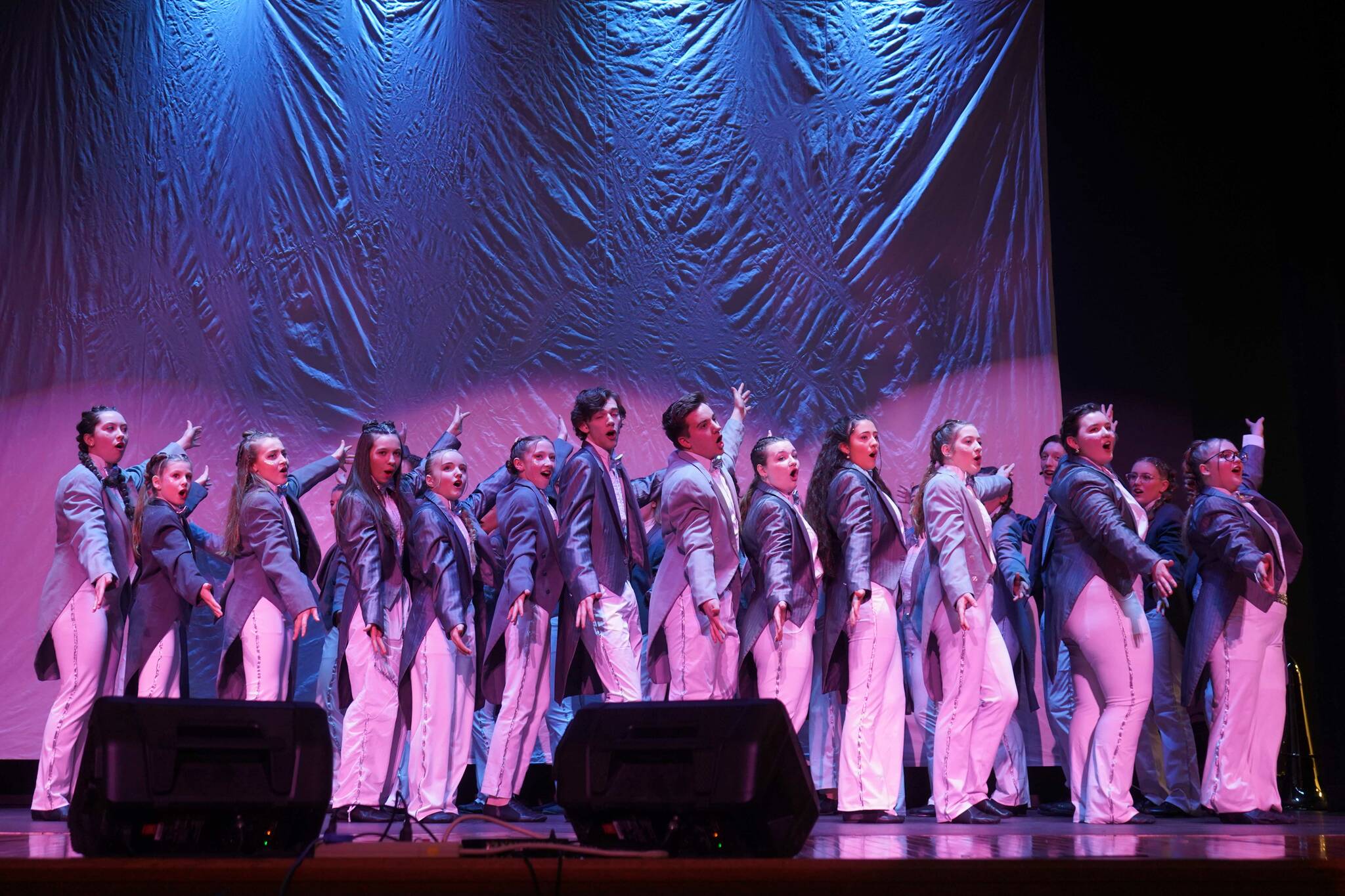 Actors perform during the opening of the new Triumvirate Theatre in Kenai, Alaska, on Saturday, April 19, 2025. (Jake Dye/Peninsula Clarion)