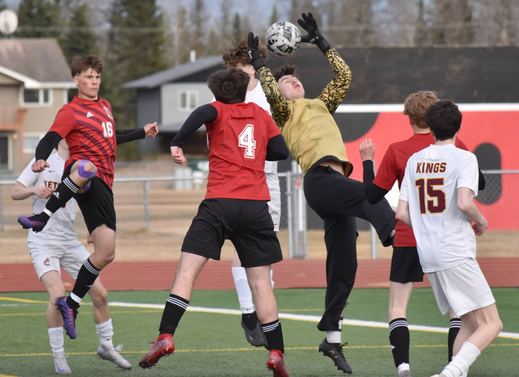Ketchikan goalie Nathan Iverson collects a corner kick in traffic Wednesday, April 23, 2025, at Ed Hollier Field at Kenai Central High School in Kenai, Alaska. (Photo by Jeff Helminiak/Peninsula Clarion)