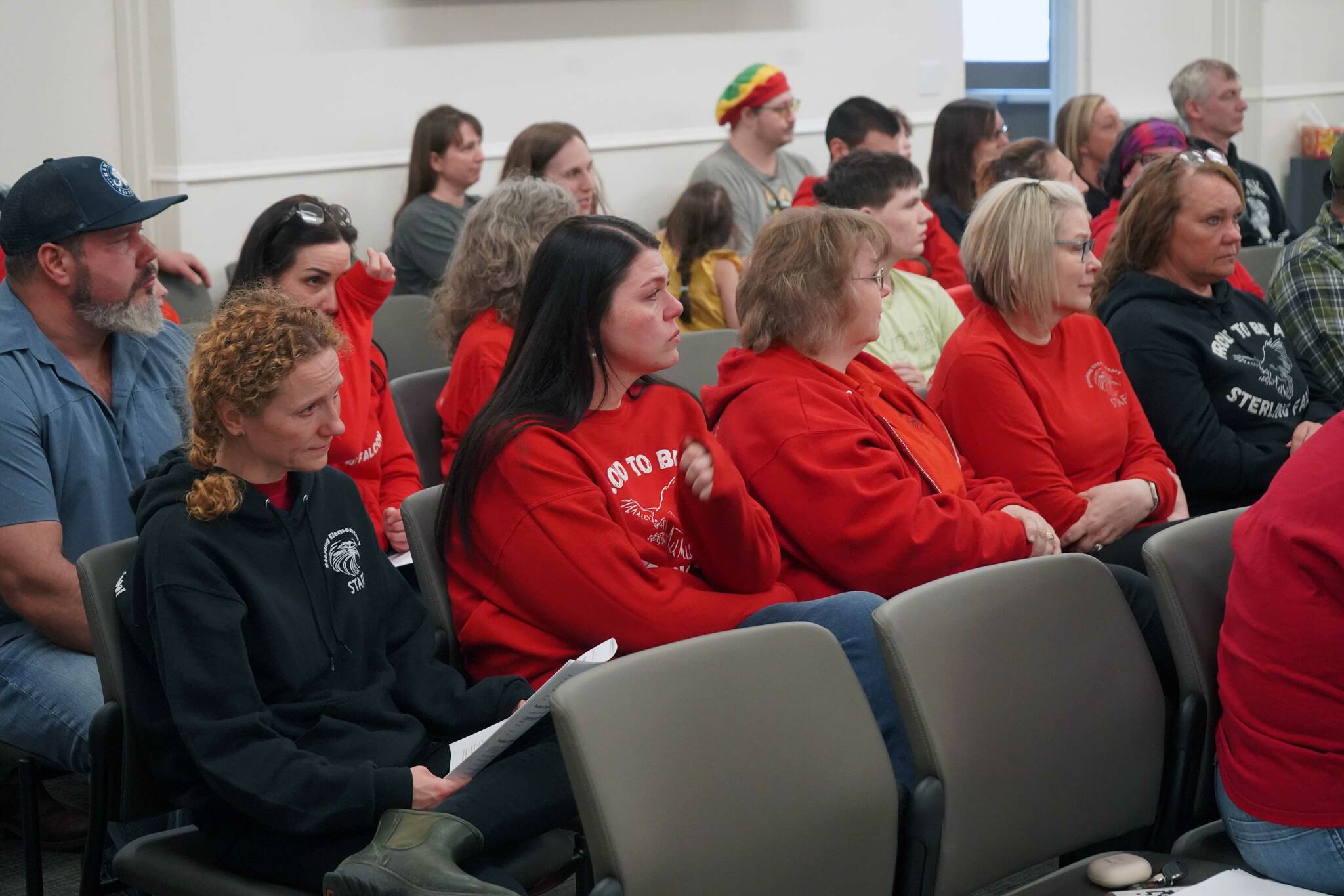 Dozens of supporters of Sterling Elementary School fill the assembly chambers during a special meeting of the Kenai Peninsula Borough School District Board of Education in Soldotna, Alaska, on Wednesday, April 23, 2025. (Jake Dye/Peninsula Clarion)
