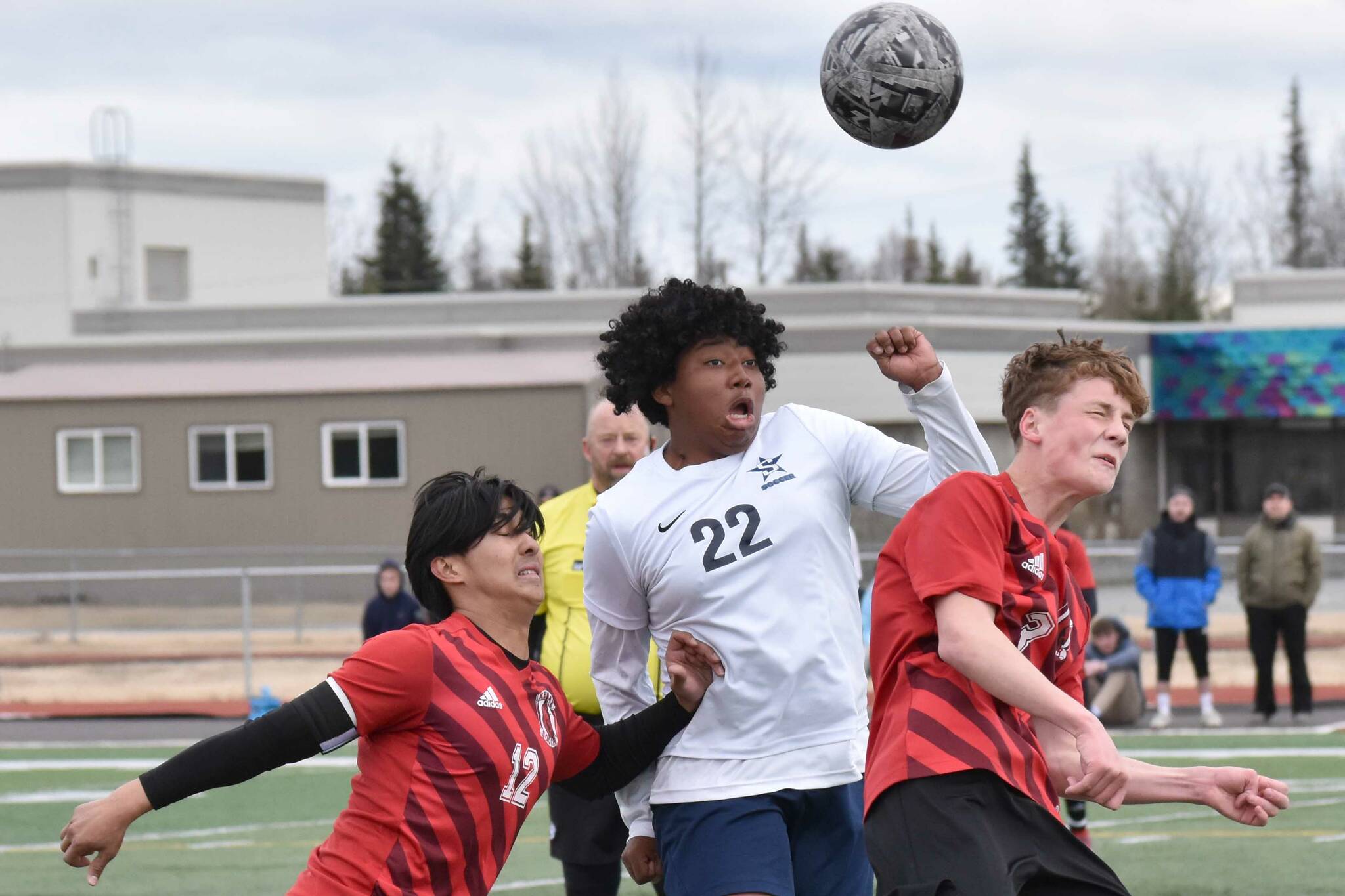 Kenai Central's Enrique Mercado and Carter Felchle battle with Soldotna's Trae Pitsch for the ball Saturday, April 26, 2025, at Ed Hollier Field at Kenai Central High School in Kenai, Alaska. (Photo by Jeff Helminiak/Peninsula Clarion)