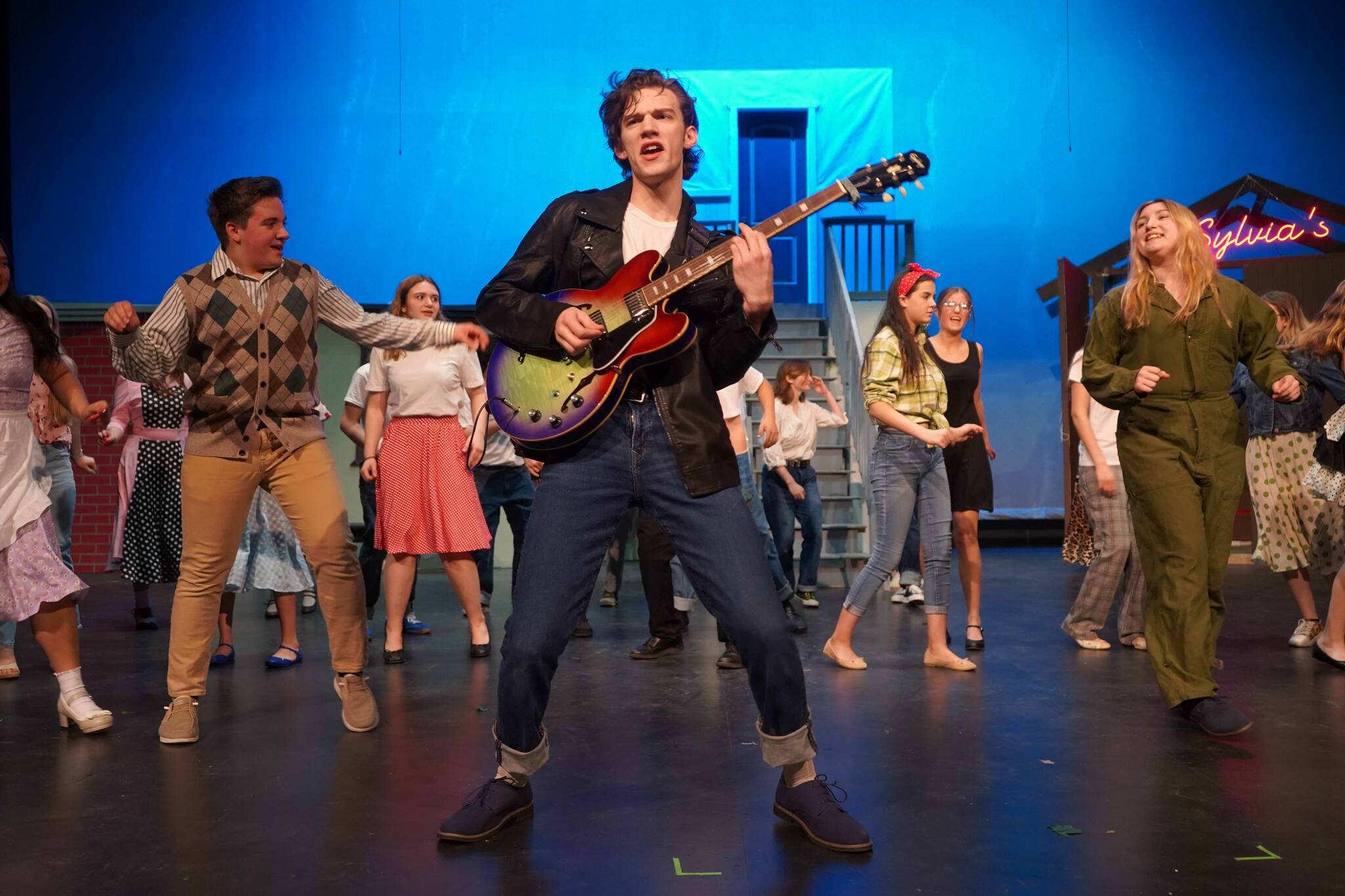 Nikiski Bulldog Theatre actors rehearse “All Shook Up” in the Nikiski Middle/High School Auditorium on Saturday, April 26, 2025. (Jake Dye/Peninsula Clarion)