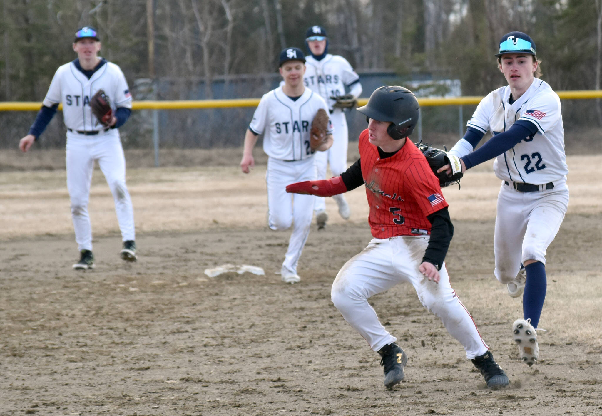 Soldotna’s Jett Brophy tags out Daniel Steffensen on Monday, April 28, 2025, at the Soldotna Little League fields in Soldotna, Alaska. (Photo by Jeff Helminiak/Peninsula Clarion)