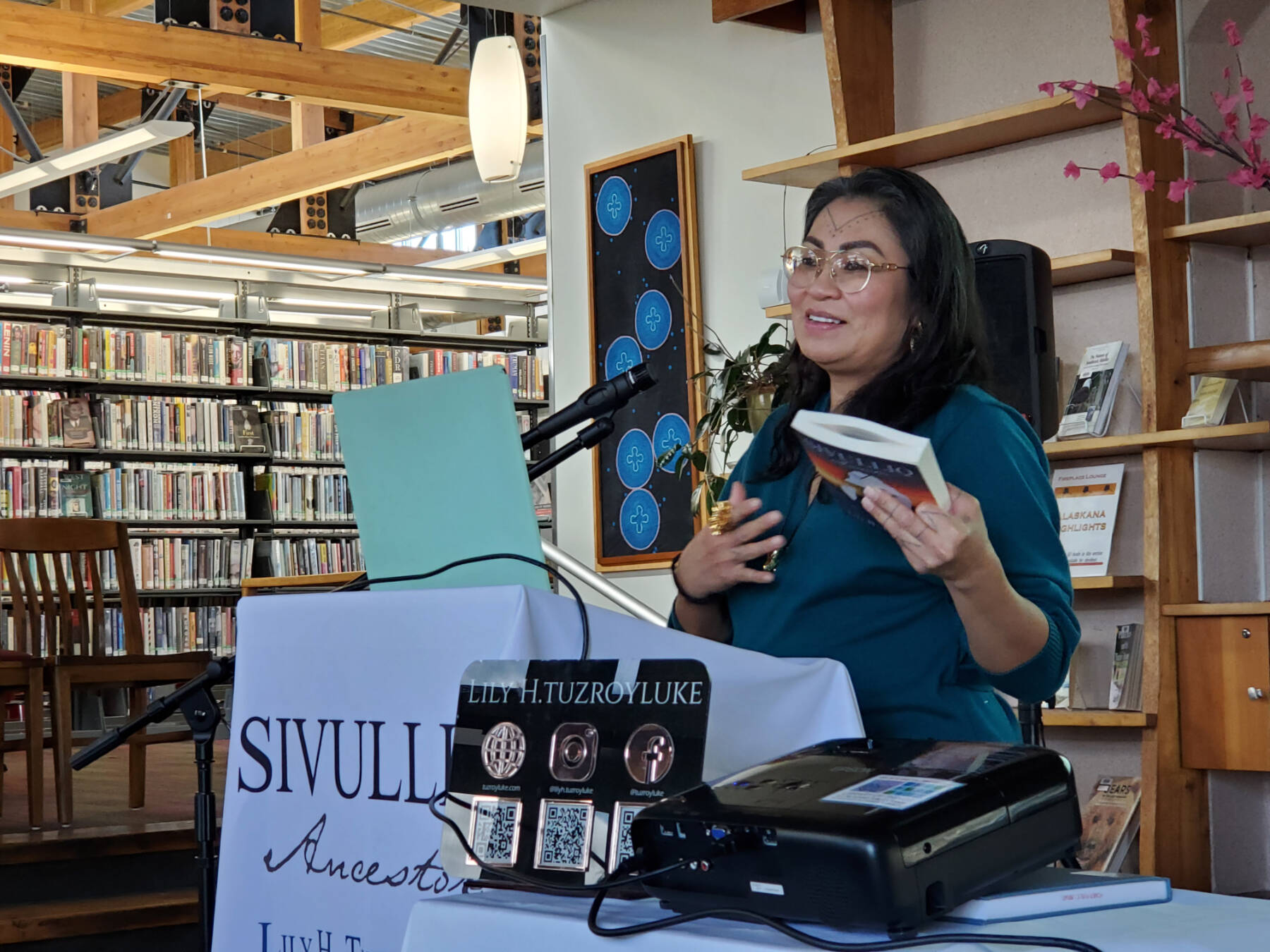 Alaska Reads author Lily H. Tuzroyluke speaks to an audience in the Homer Public Library Fireplace Lounge on Thursday, April 24, 2025, in Homer, Alaska. (Delcenia Cosman/Homer News)