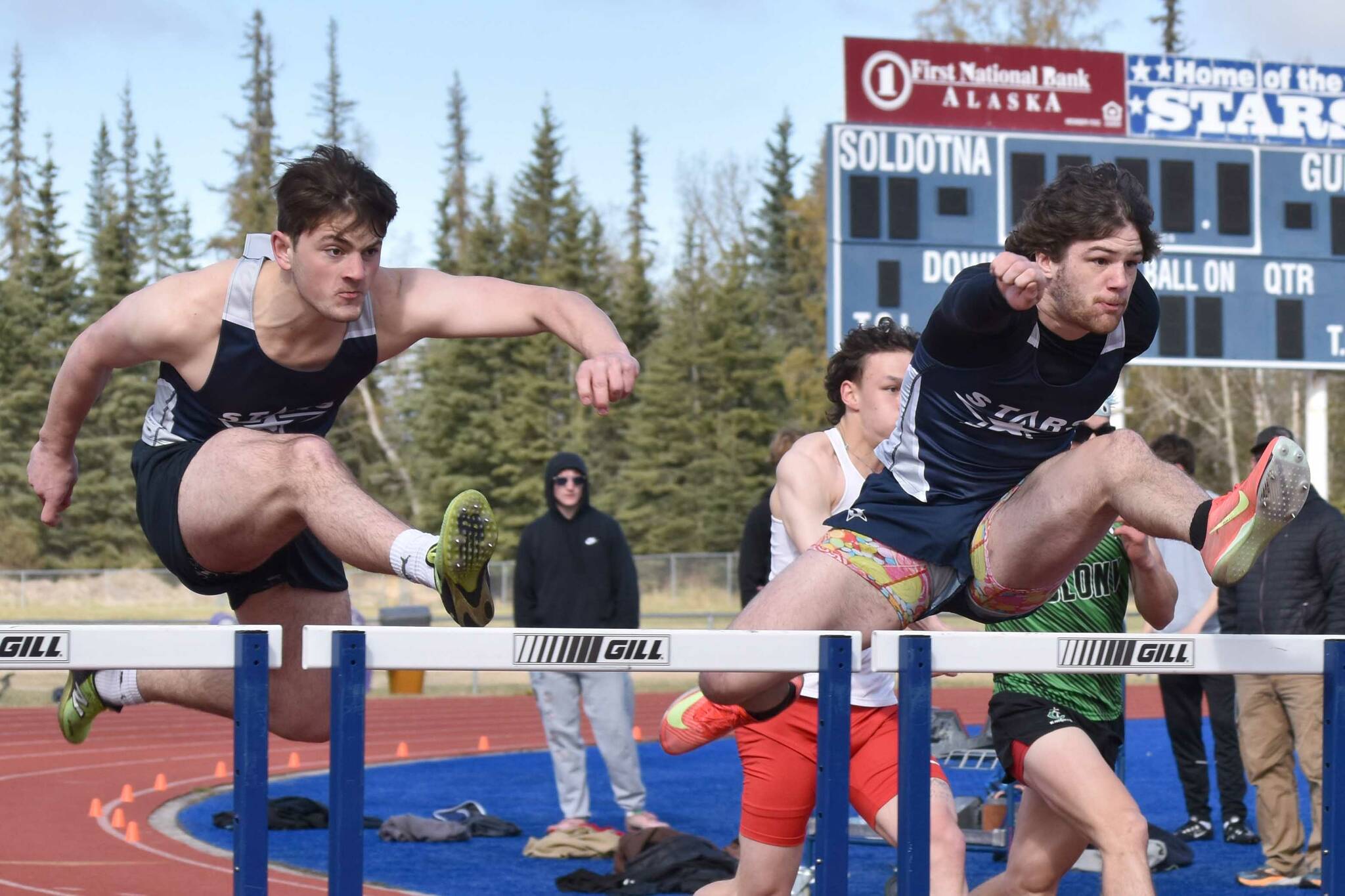 Soldotna's William Klein and Wyatt Faircloth compete in the 110-meter hurdles at the SoHi Invite on Saturday, May 3, 2025, at Soldotna High School in Soldotna, Alaska. (Photo by Jeff Helminiak/Peninsula Clarion)