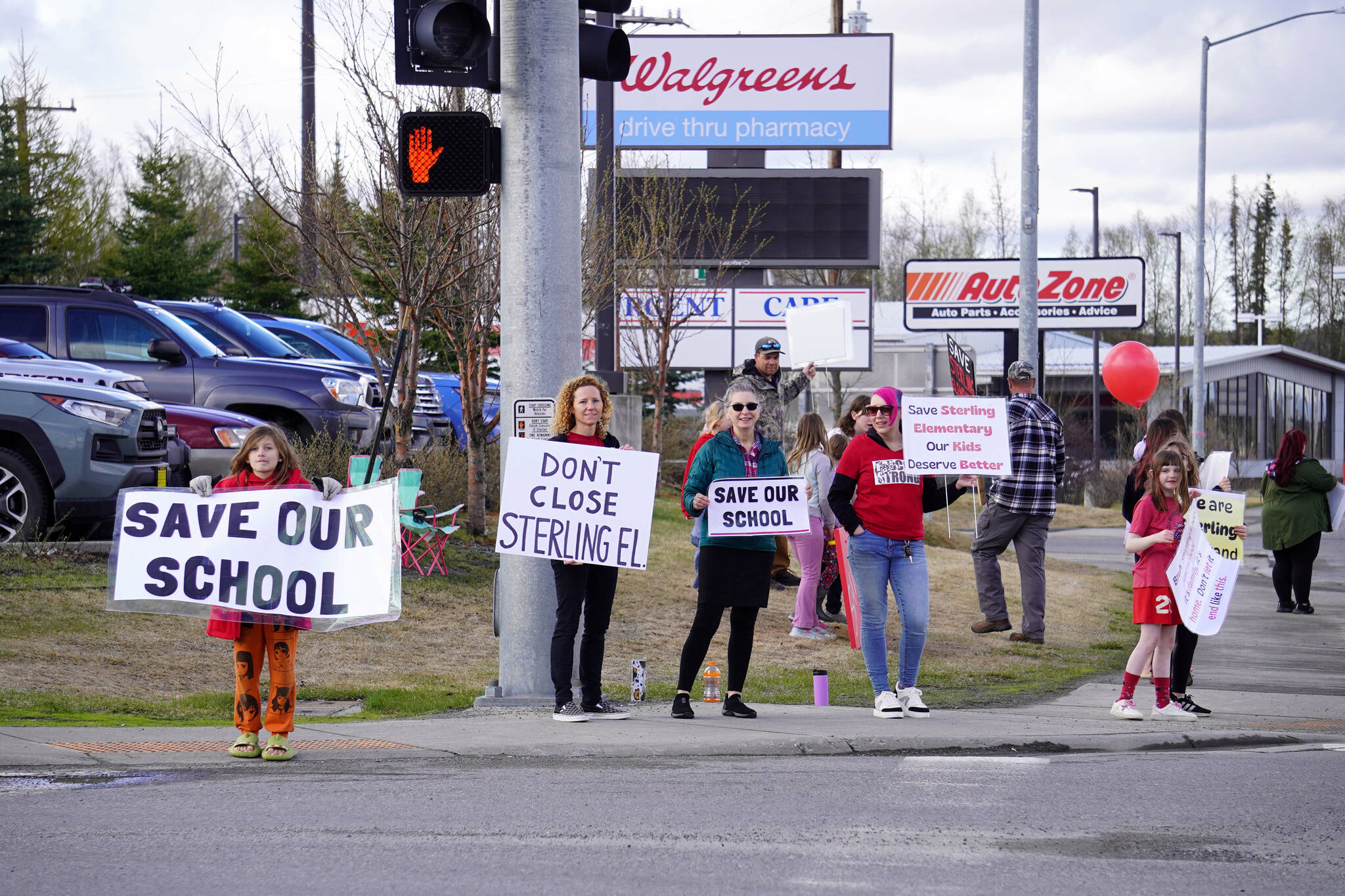Students, parents and teachers protest the possible closure of Sterling Elementary School along the Sterling Highway in Soldotna, Alaska, on Saturday, May 3, 2025. (Jake Dye/Peninsula Clarion)