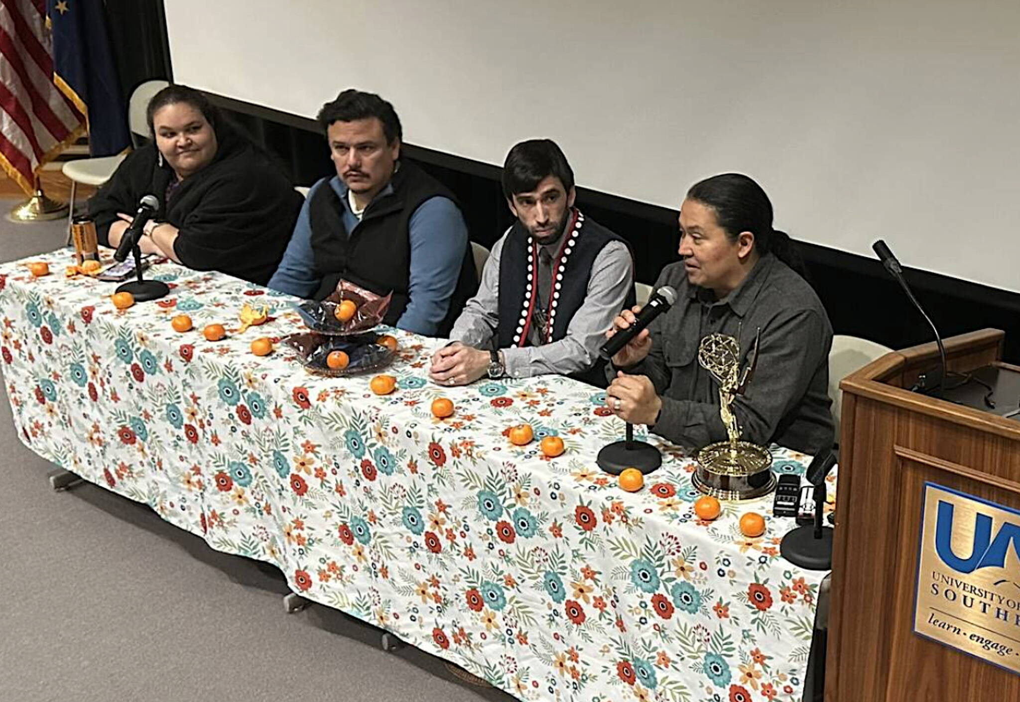 X̱’unei Lance Twitchell (holding microphone) discusses writing an Emmy-winning episode of “Molly of Denali” during a forum with fellow Juneau show writers Vera Starbard, Frank Katasse and ‘Wáats’asdiyei Joe Yates on Saturday, April 19, 2025, at the University of Alaska Southeast. (Mark Sabbatini / Juneau Empire file photo)