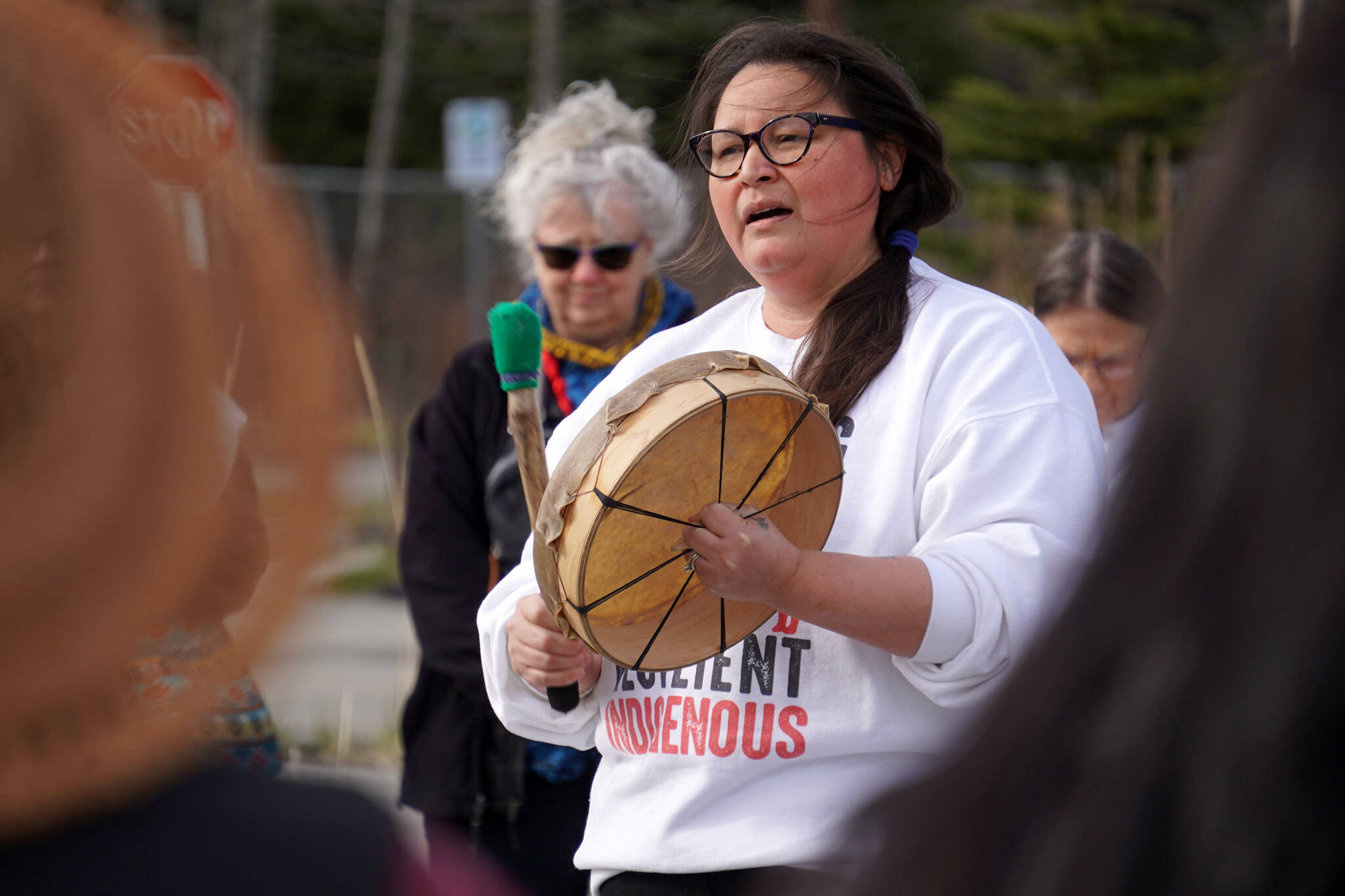 Kenaitze Indian Tribe chemical dependency councilor Jamie Ball performs during a candlelight vigil marking National Day of Awareness for Missing and Murdered Indigenous Women and Girls at the Raven Plaza, Ggugguyni T’uh, in front of the Dena’ina Wellness Center in Kenai, Alaska, on Monday, May 5, 2025. (Jake Dye/Peninsula Clarion)