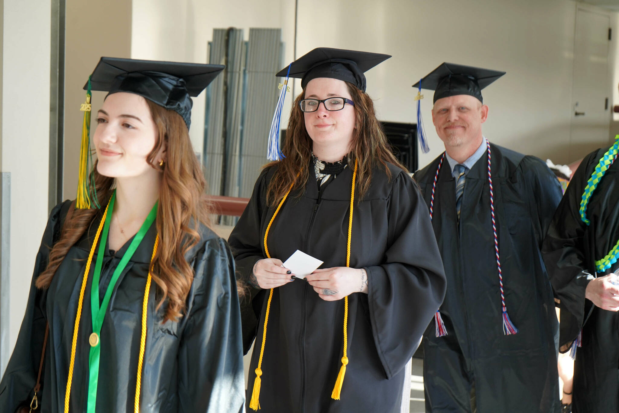 Graduates process into the 55th Annual Kenai Peninsula College Commencement Ceremony, held at Kenai Central High School in Kenai, Alaska, on Thursday, May 8, 2025. (Jake Dye/Peninsula Clarion)